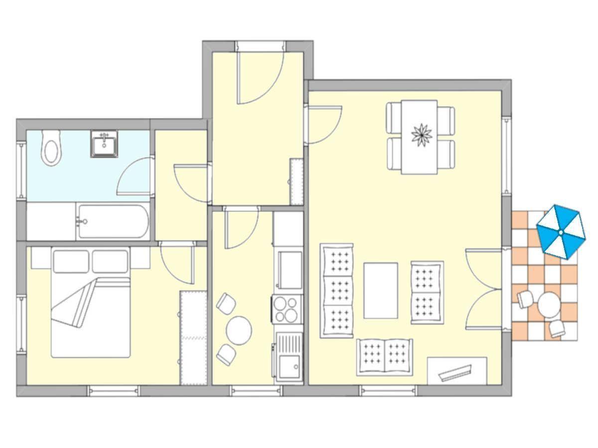 Dieses Apartment hat eine Küche, ein Schlafzimmer, ein Bad und eine Terrasse mit Sonnenschirm.