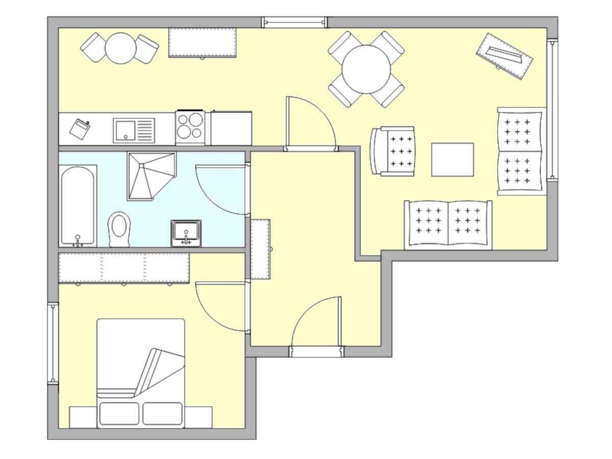 Wohnung mit Küche, Essbereich, Schlafzimmer und Bad.