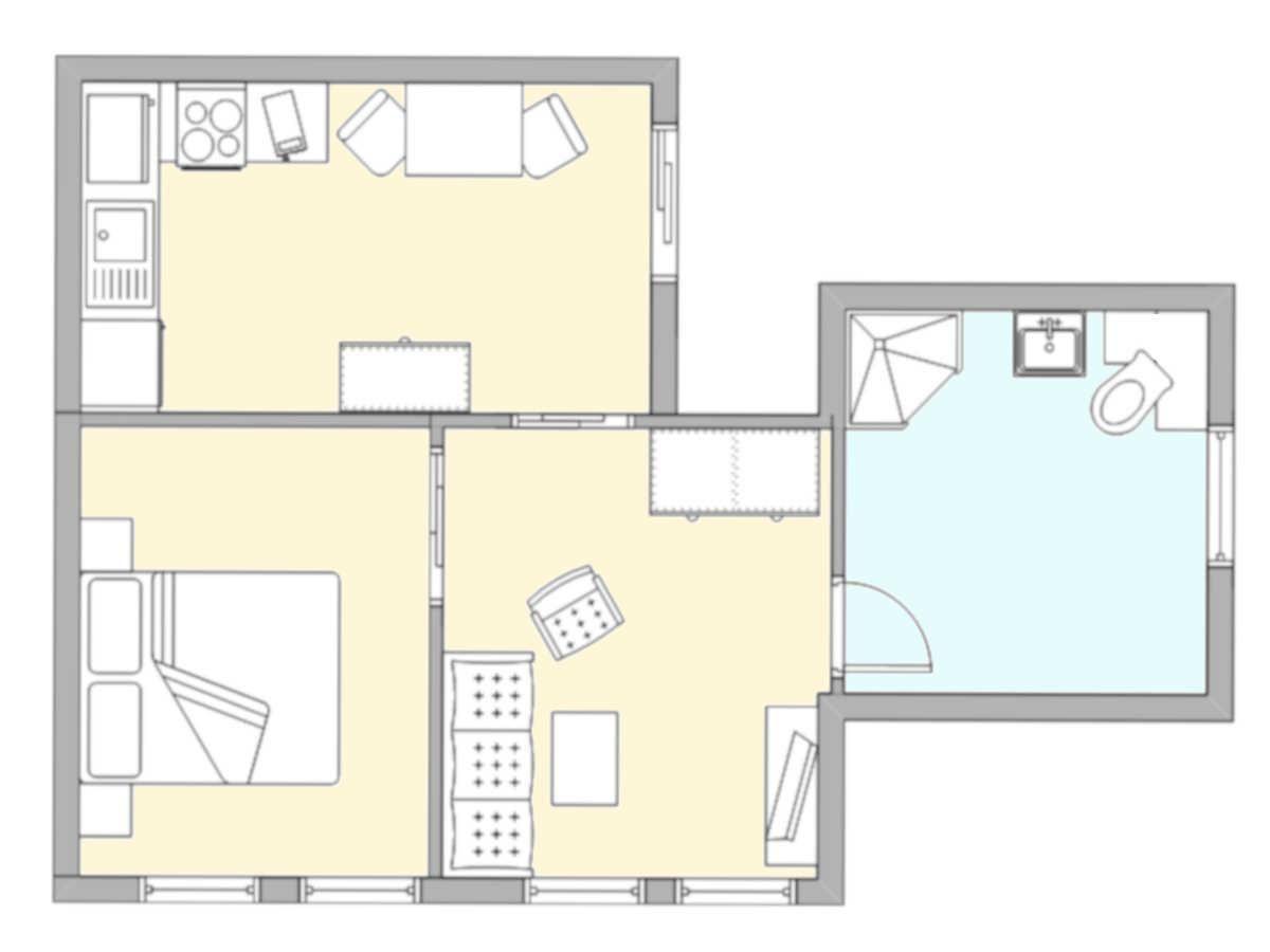 Dieses Apartment hat eine Küche, ein Wohnzimmer, ein Schlafzimmer und ein Badezimmer.