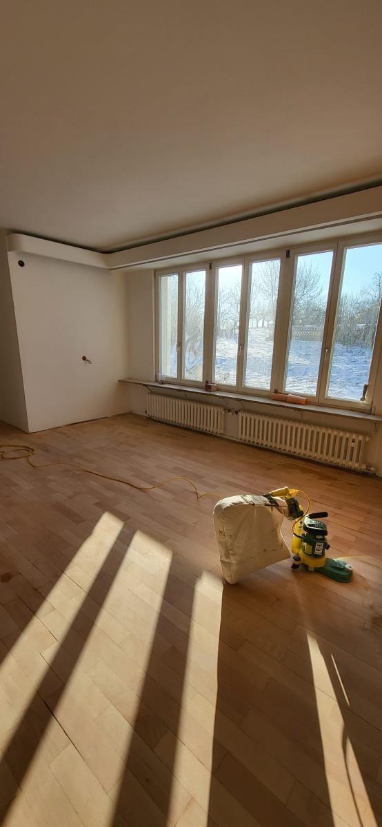 Rooms with wooden floor and window front to outside