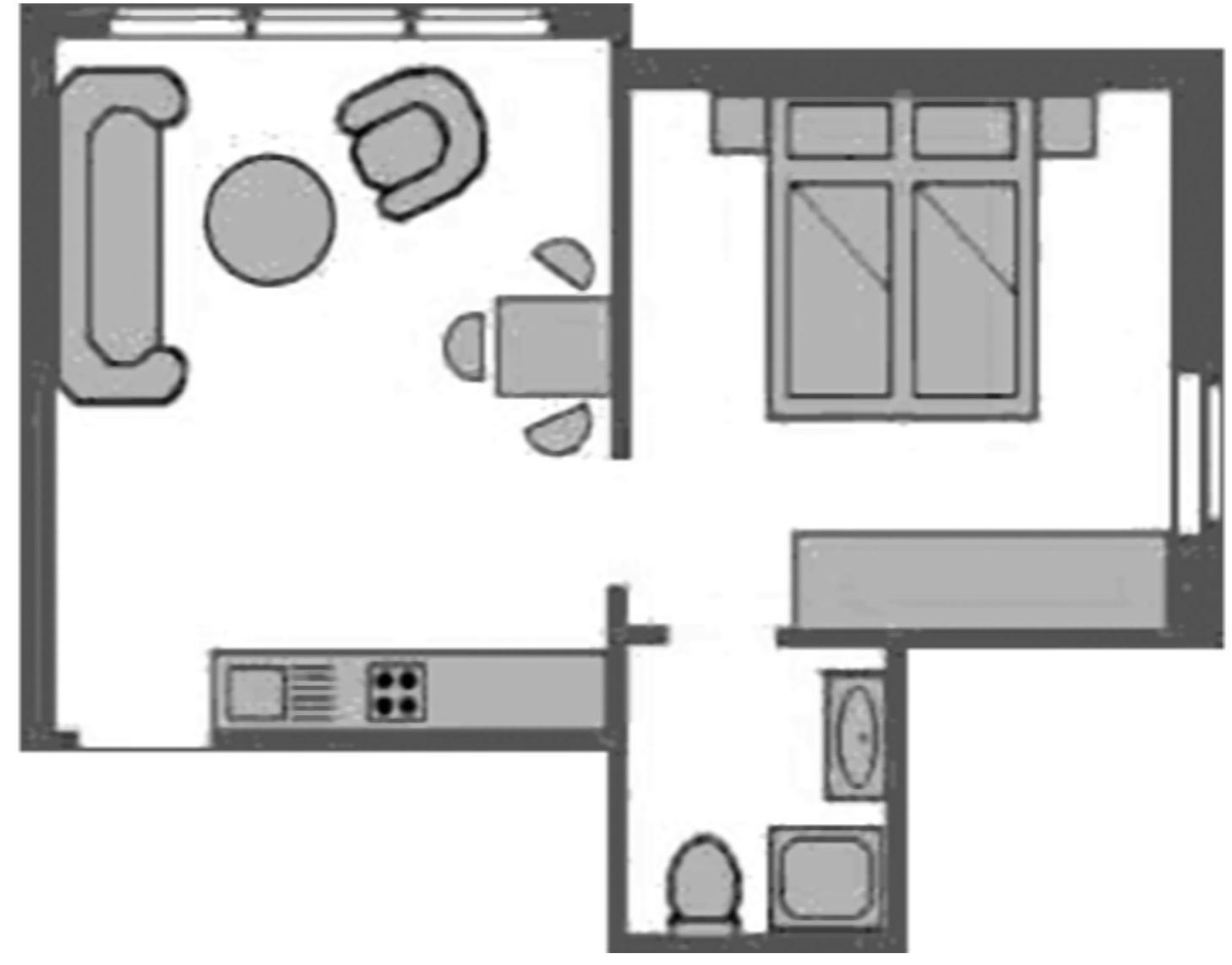 Wohnung mit Küche, Schlafzimmer und Bad. Essbereich mit Tisch und Stühlen.