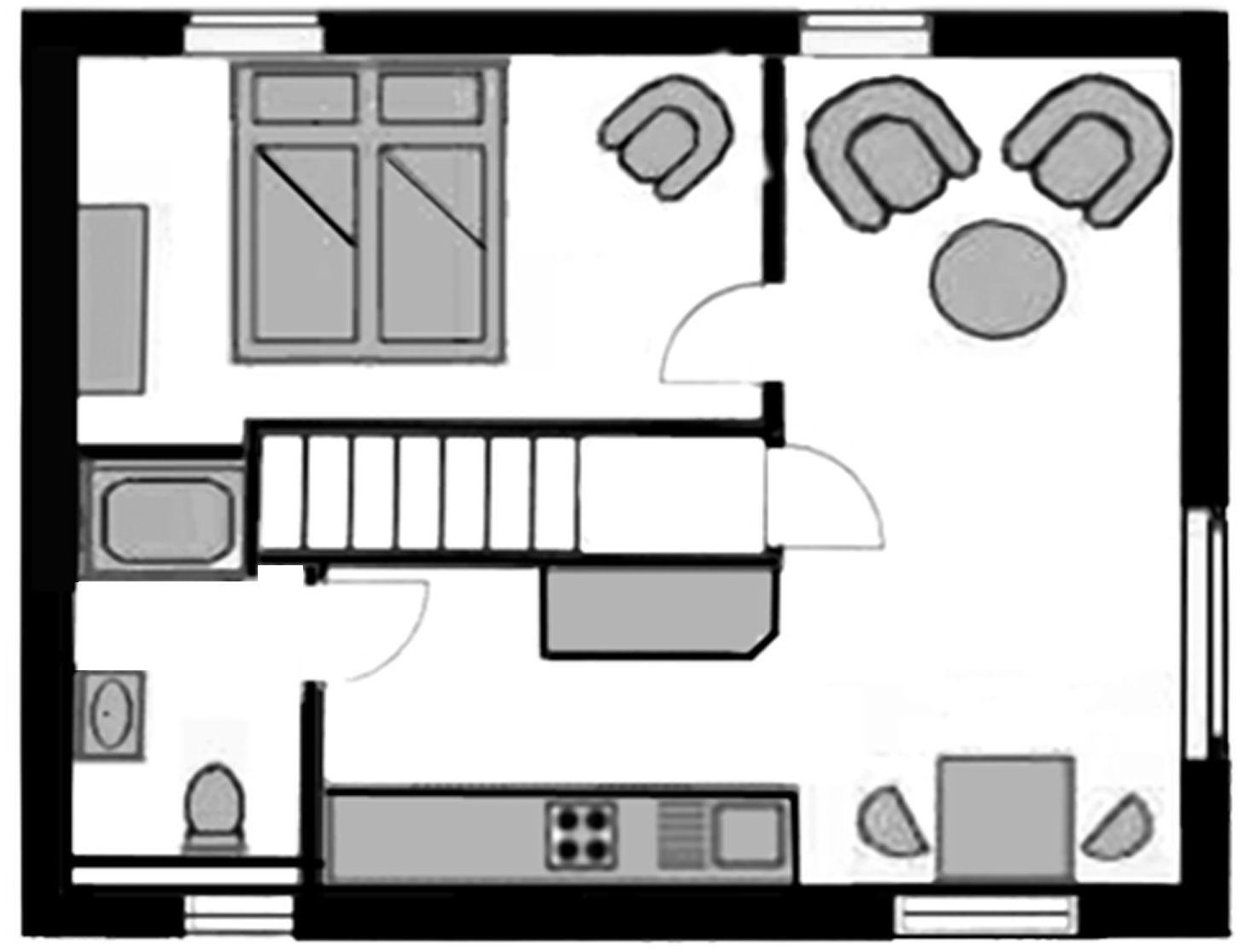 Dieses Apartment hat eine Küche, ein Bad, einen Wohnbereich und eine Treppe.