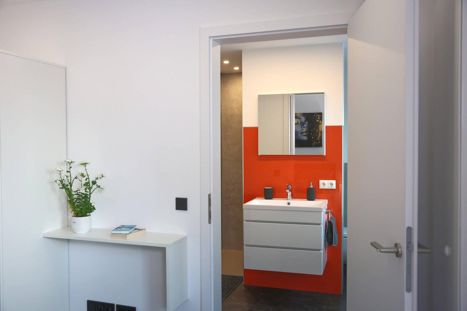 View of the bathroom, including underfloor heating, shower and toilet