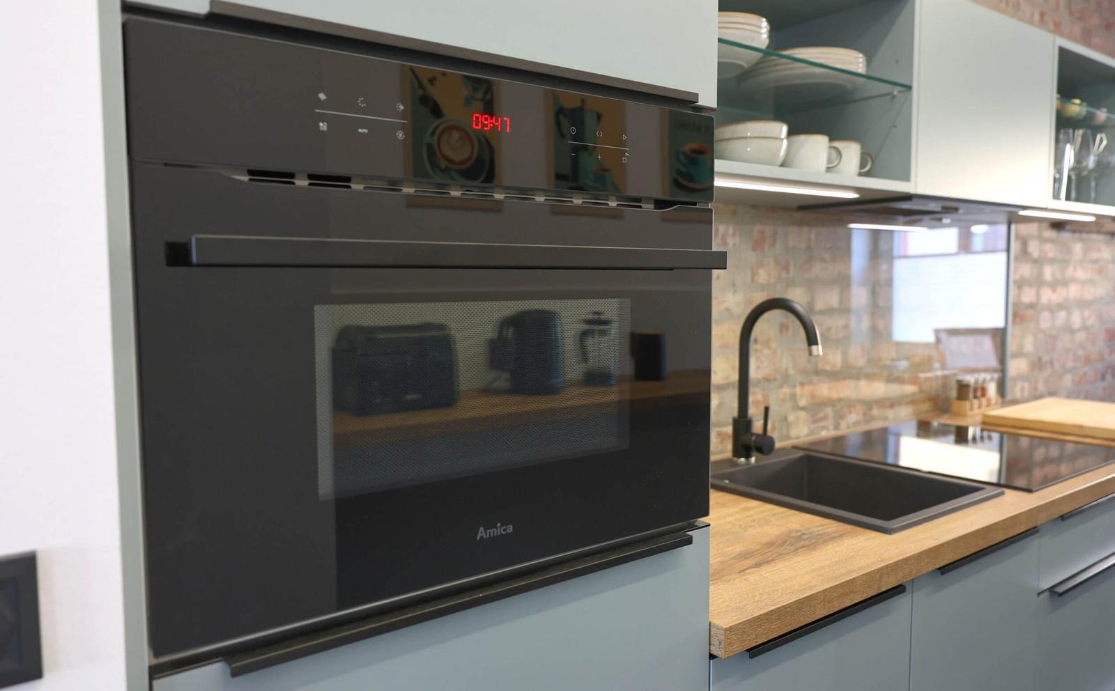 Kitchenette with oven that has a microwave function