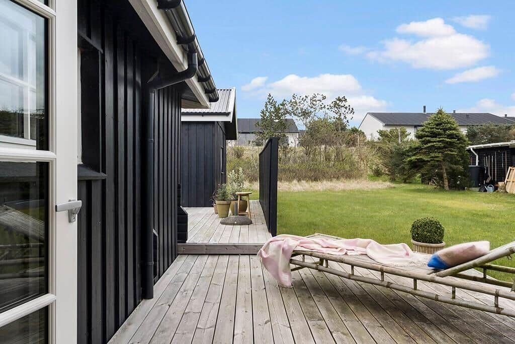 Deck with lounge chair and view of the garden