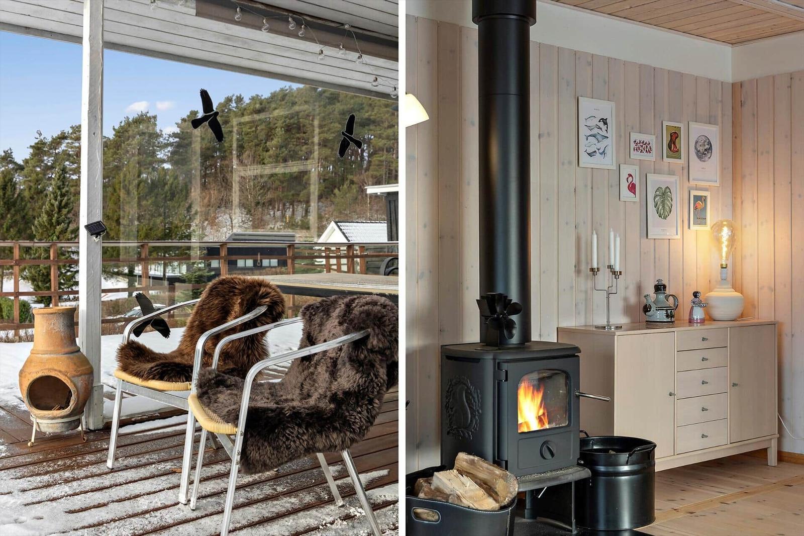 Deck with chair and fur, view of forest. Inside: fireplace with fire and wall art.