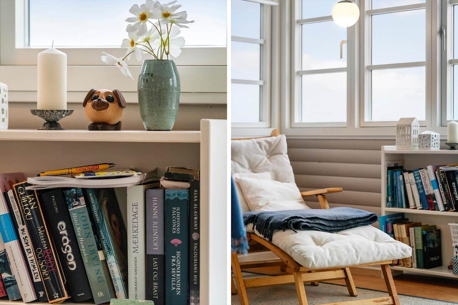 Bücherregal mit Blumen und Kerze, Sitzbank mit Decke und Fenster