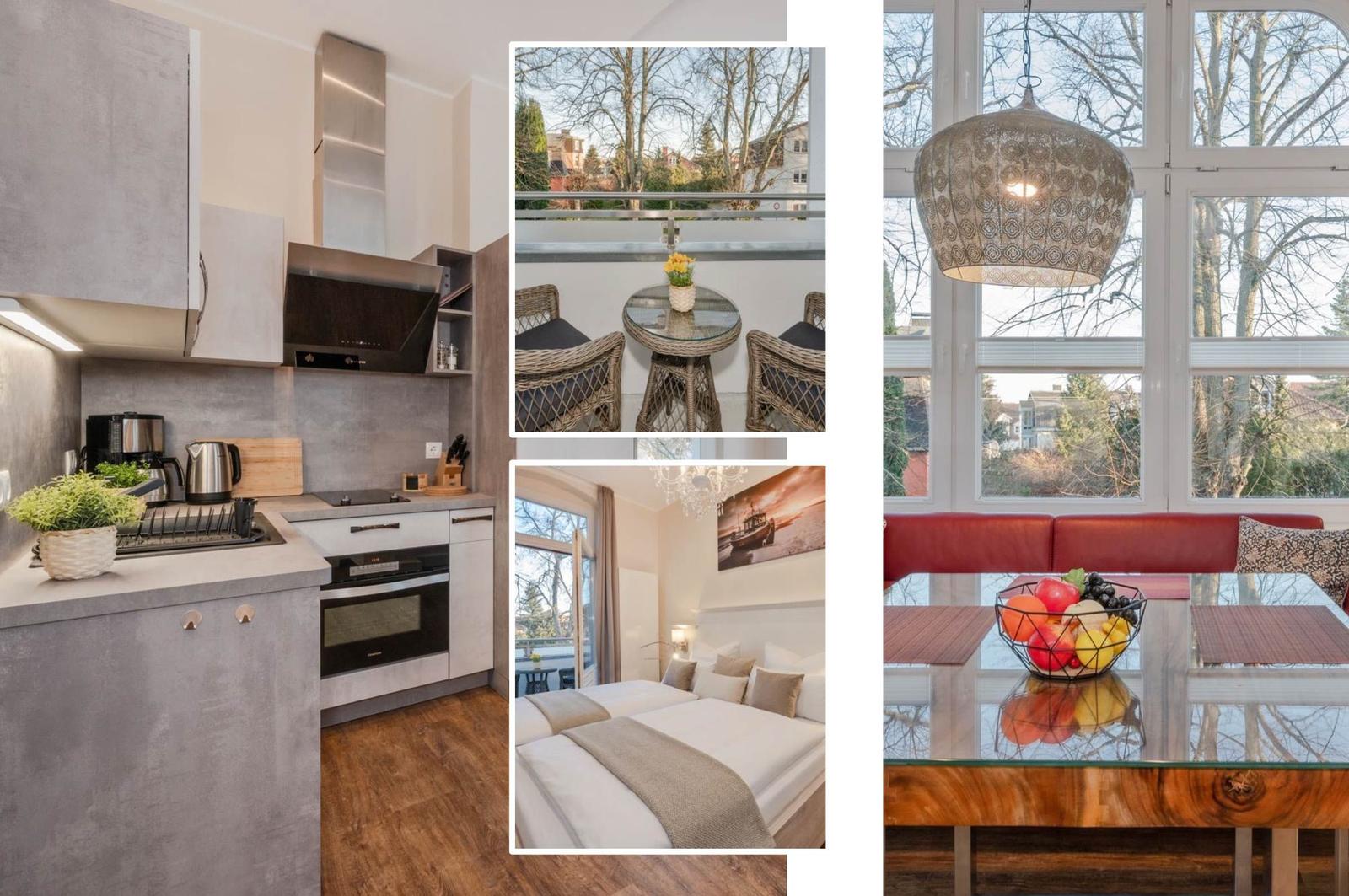 Küche mit Edelstahlgeräten, Balkon mit Tisch, Schlafzimmer mit Bett und Wohnzimmer mit Esstisch.