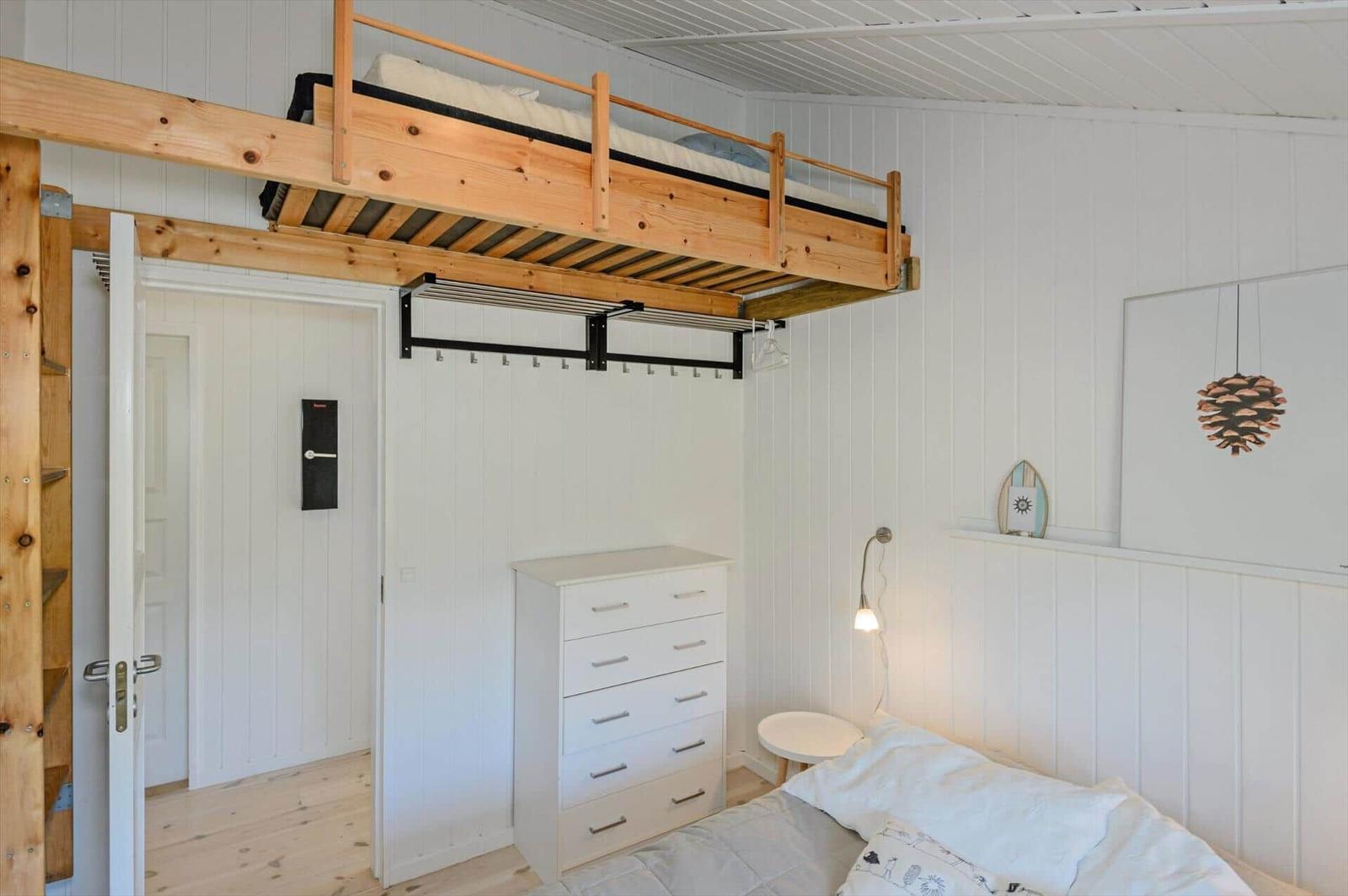 Upper loft bed and lower mattress. Dresser and bedside table.