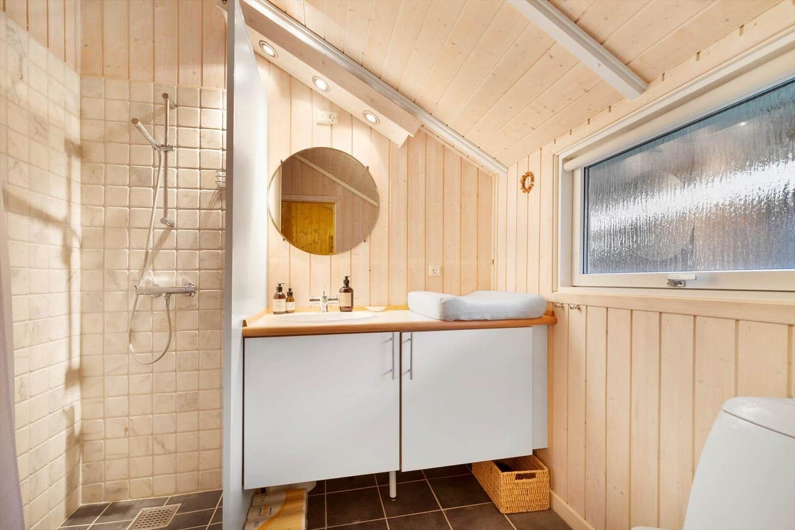 Bath with shower, sink and window