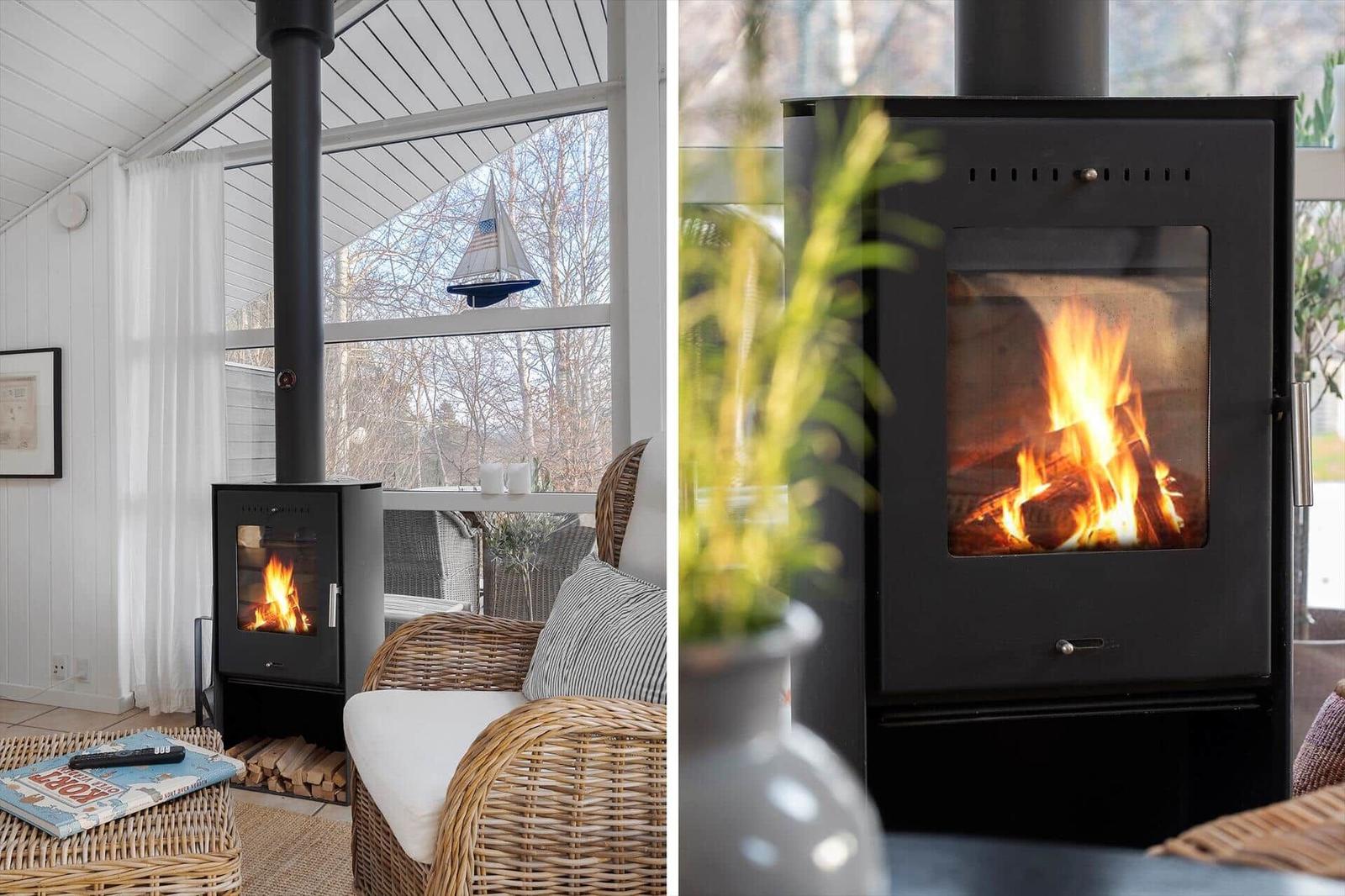 Wood-burning stove with logs and seating in the living area.