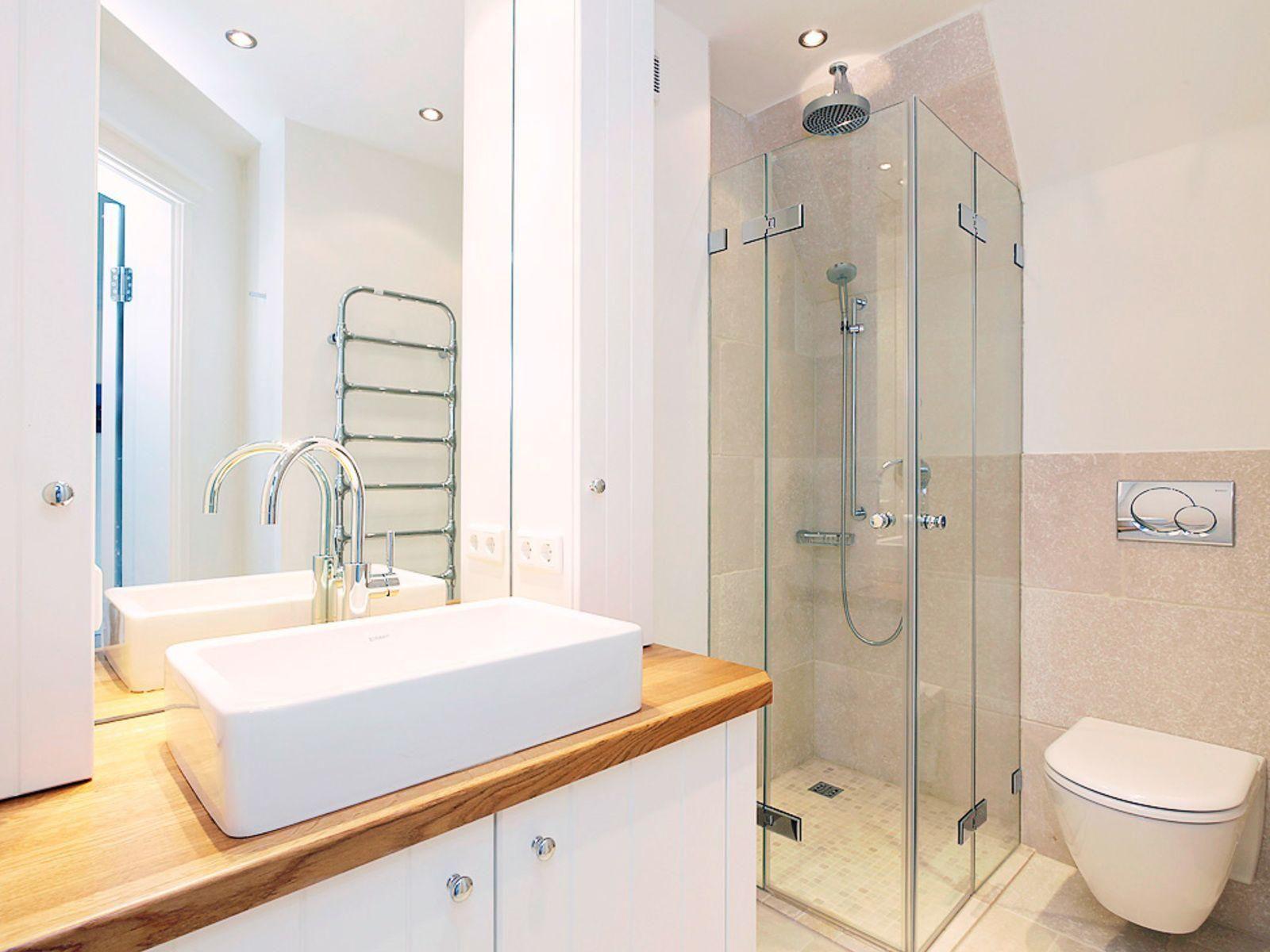 Bathroom with shower, sink, and toilet