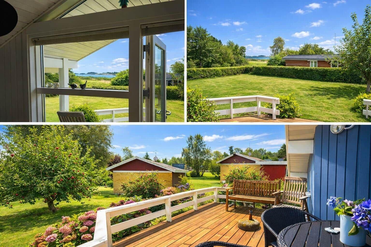Deck with view of lawn and lake. Wooden floor, garden furniture, and flowers.