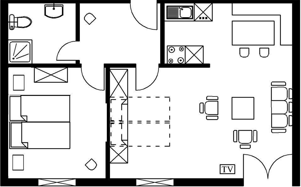 Die Wohnung hat eine Küche, ein Bad, einen Wohnbereich und ein Schlafzimmer.