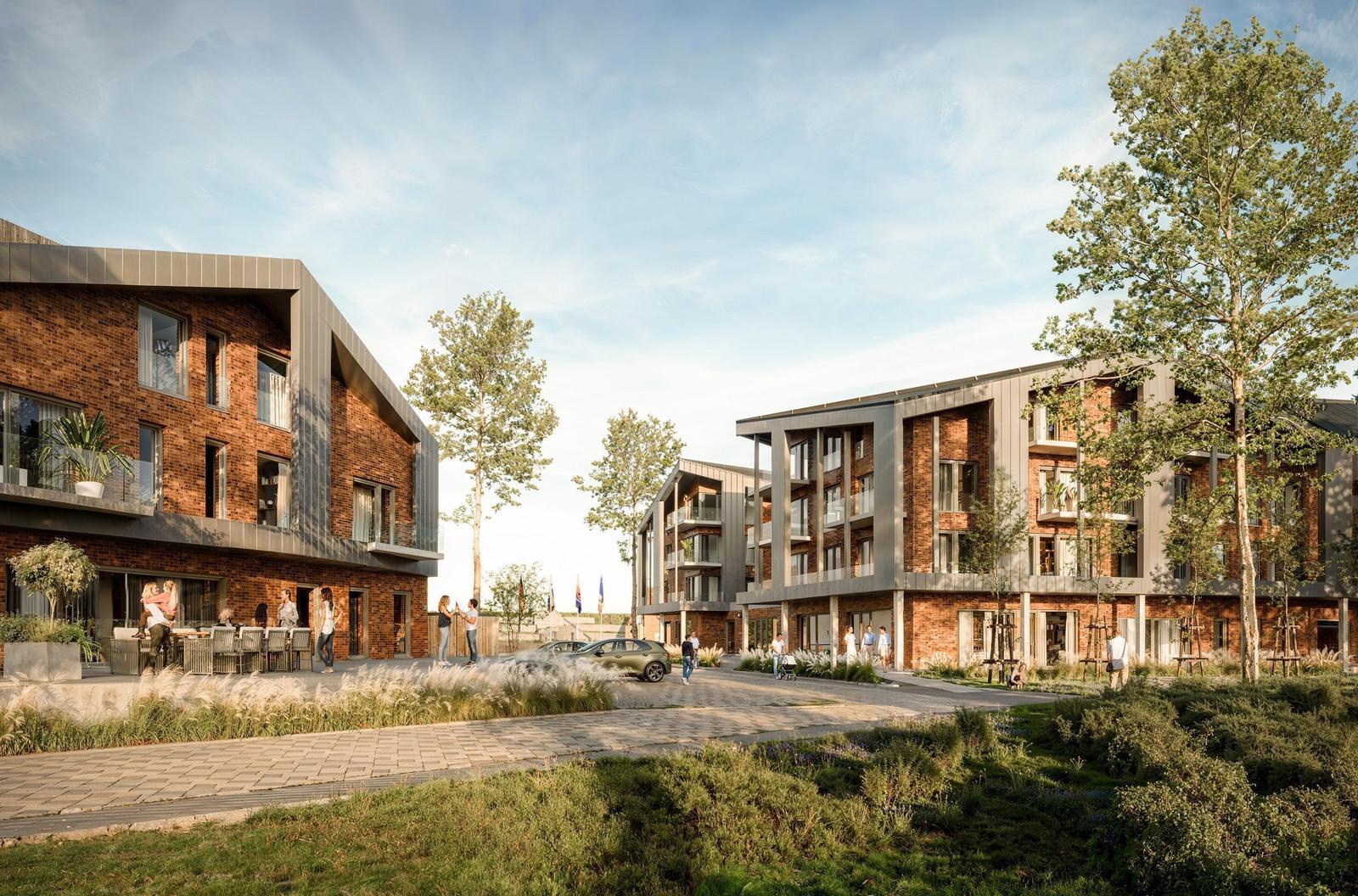 Moderne Wohnhäuser mit Balkonen und Grünflächen