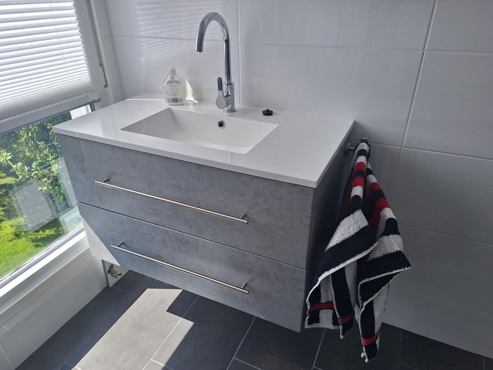 Sink with mirror, towel and window