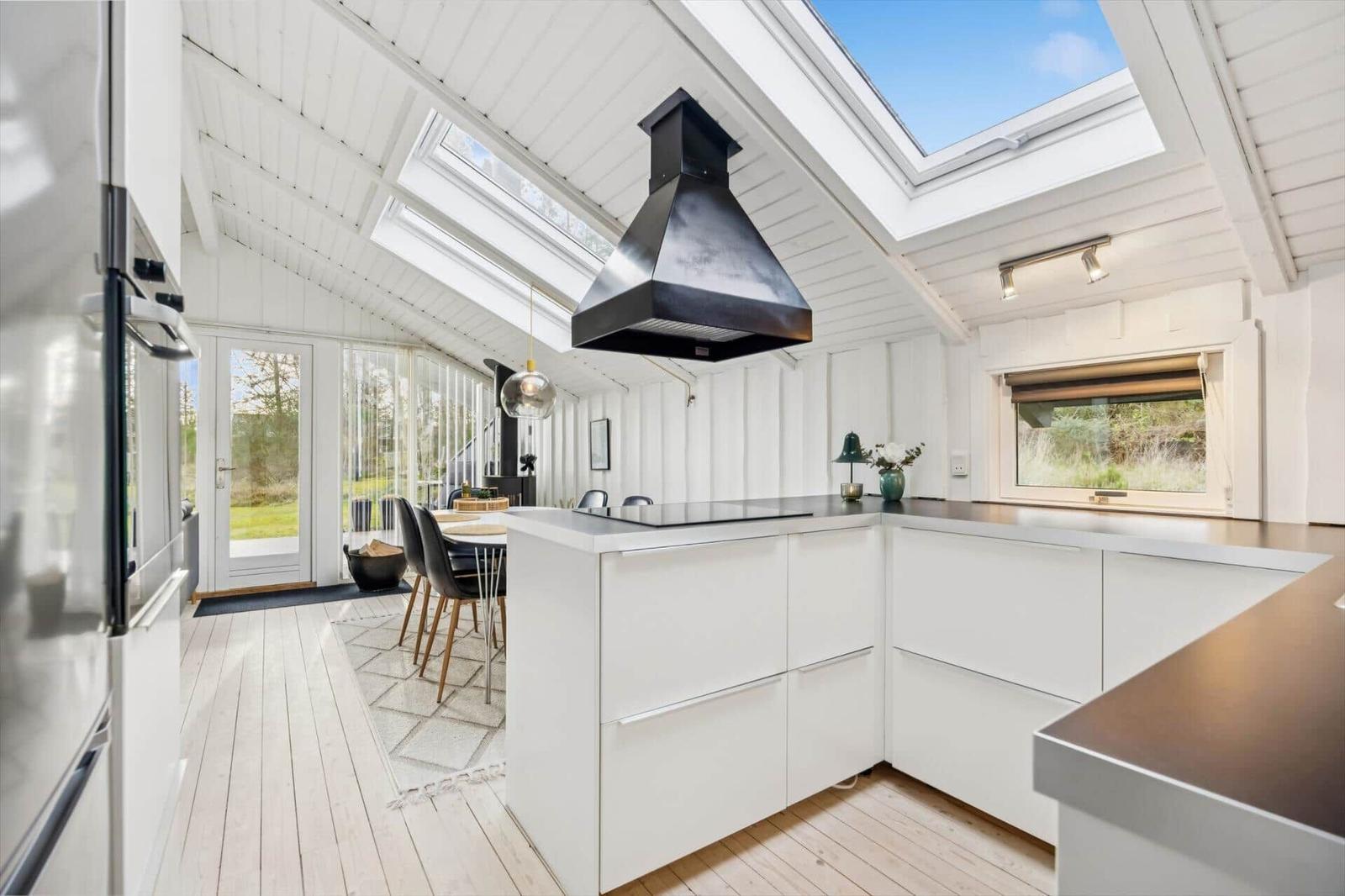 Kitchen with white countertop and skylight