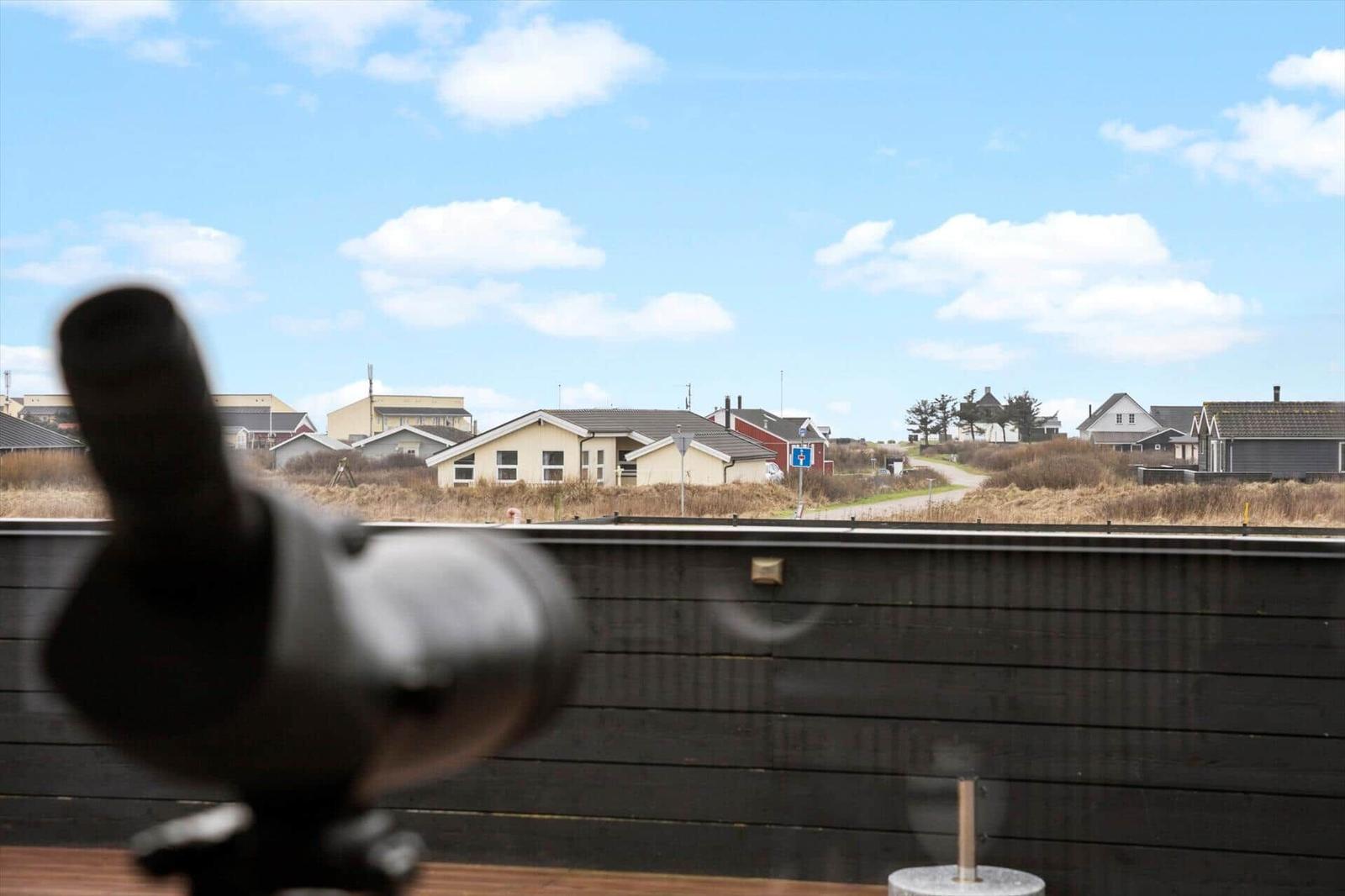 Terrace with binocular view of village and sky