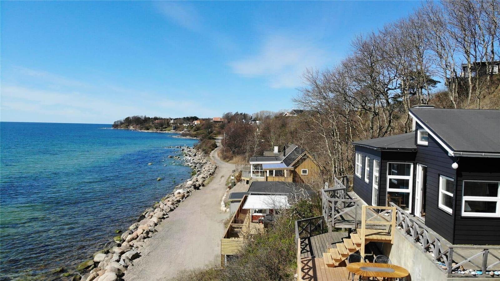 House by the sea with terrace and view of the coast.