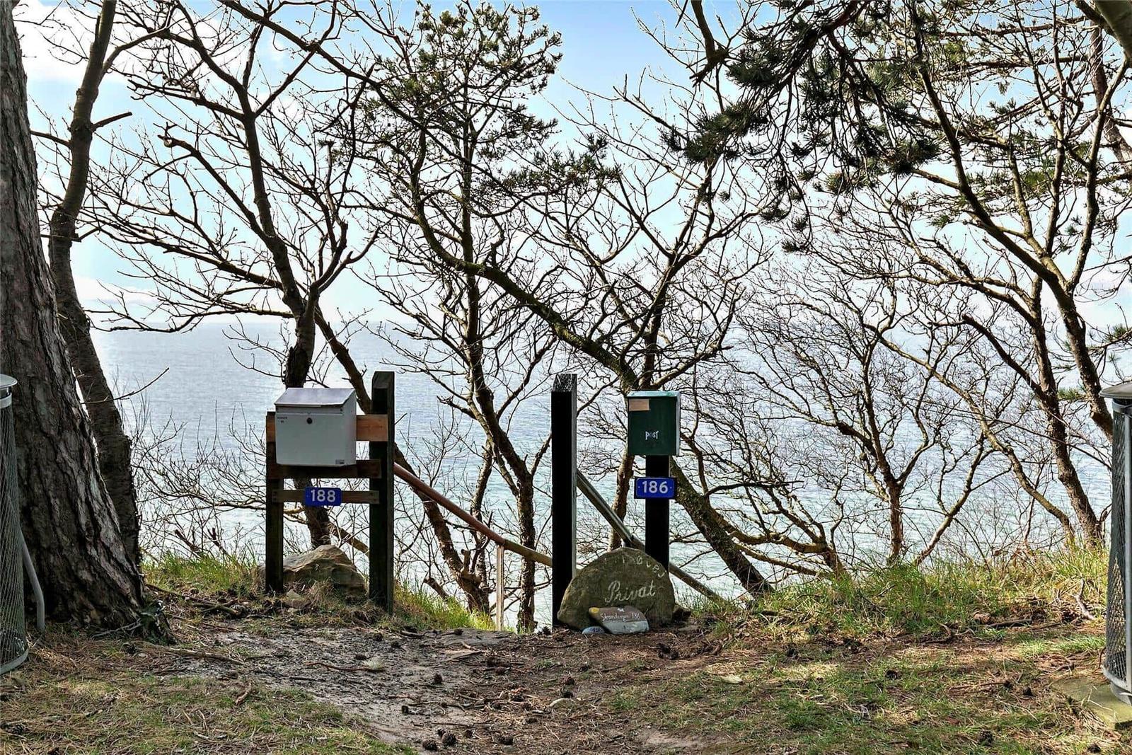 Two mailboxes along a path with sea view