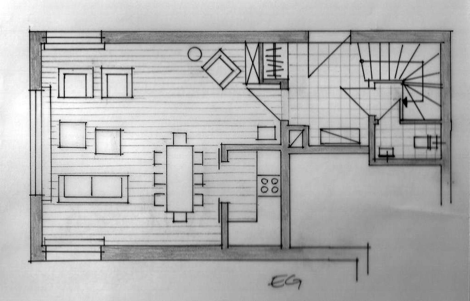 Geschossplan zeigt Küche, Essbereich, Schlafzimmer und Treppe.