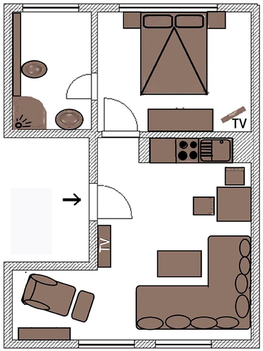 Die Wohnung hat eine Küche, ein Schlafzimmer, ein Bad und eine Wohnküche.