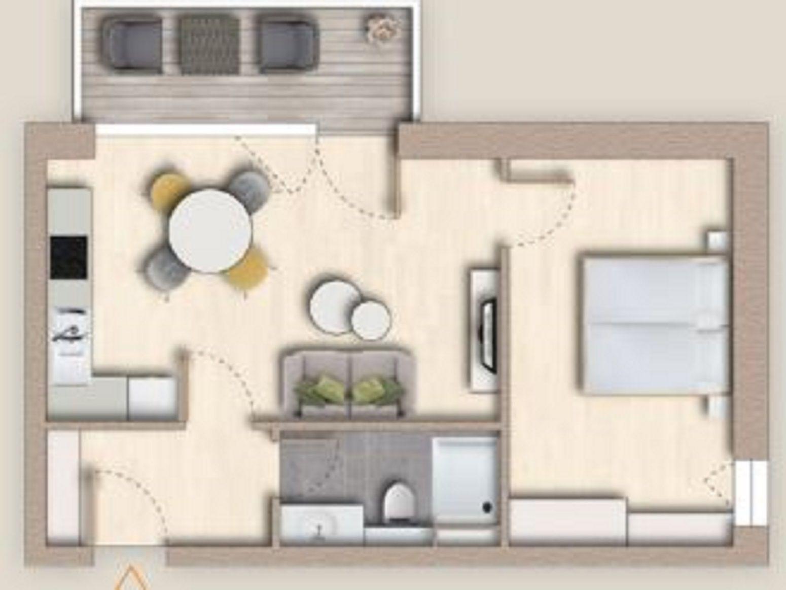 Ein Raumplan mit Küche, Wohnbereich, Schlafzimmer und Bad.