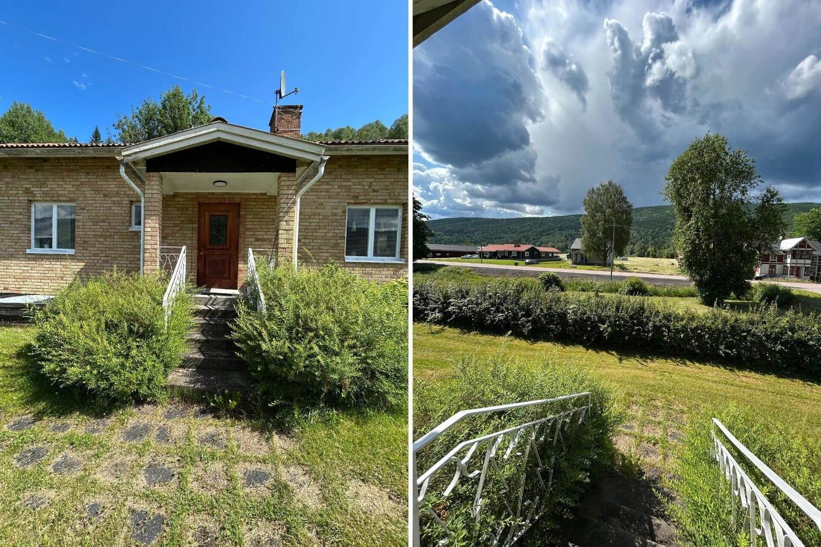 Haus mit Vorgarten und Blick auf bewaldete Hügel unter dramatischem Himmel.