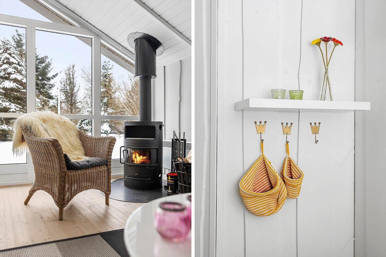 Living area with fireplace and seating. Adjacent space with hooks and basket.