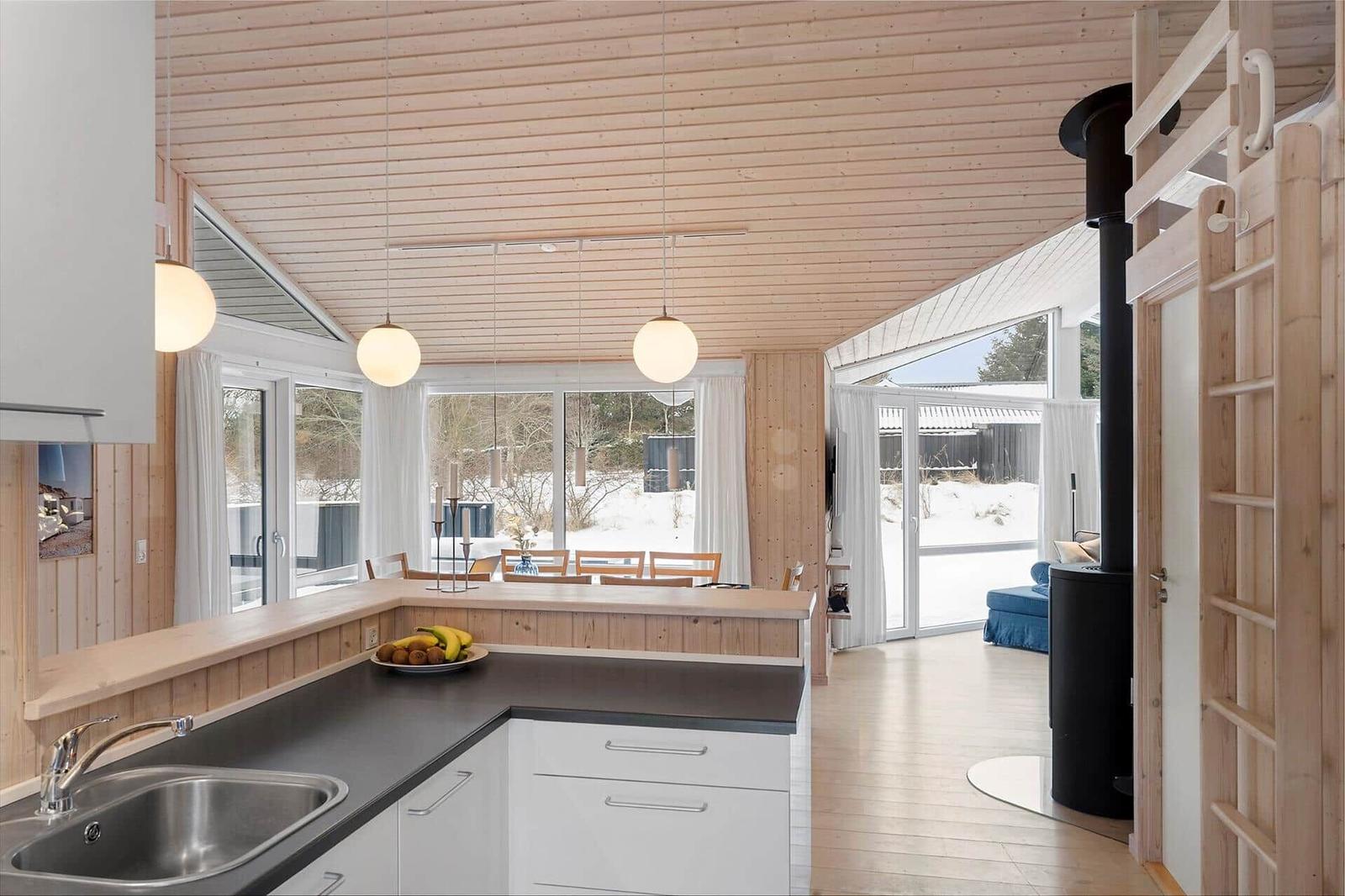Kitchen with dining area and view of snow