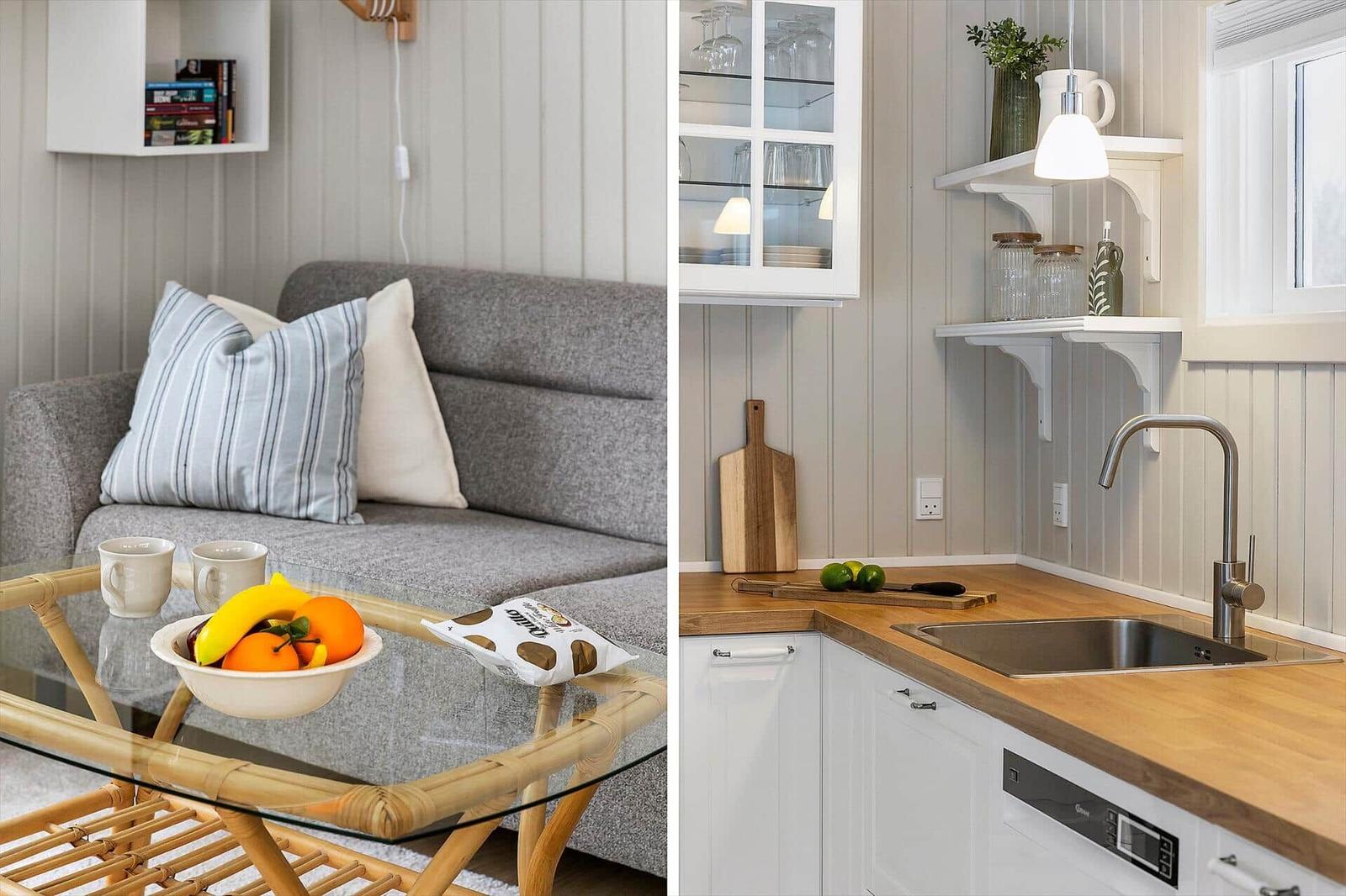 Living area with sofa and glass table. Kitchen with wooden worktop and sink.