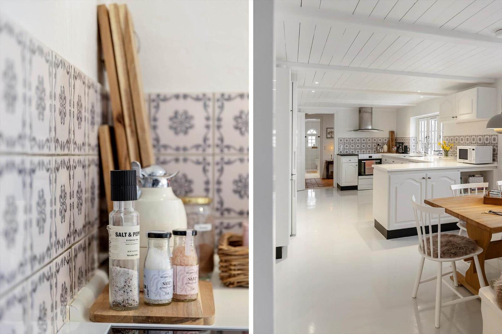 Küche mit weißem Schrank und Mosaikfliesen an der Wand