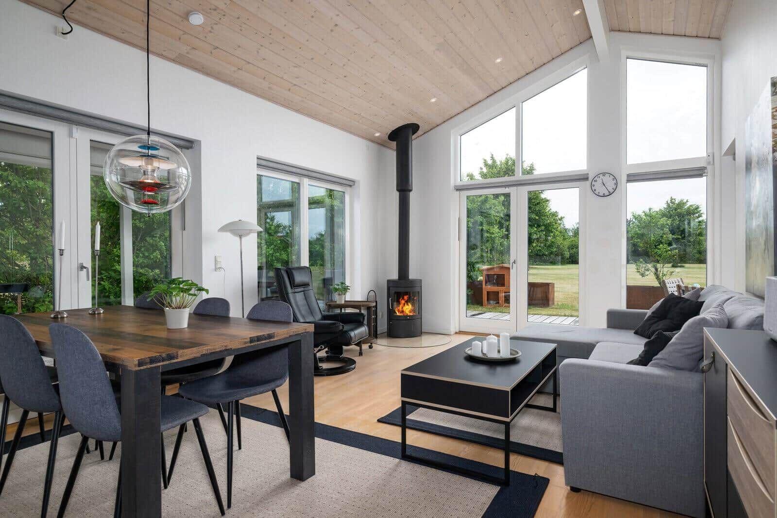 Spacious living and dining area with fireplace, seating, and dining table.