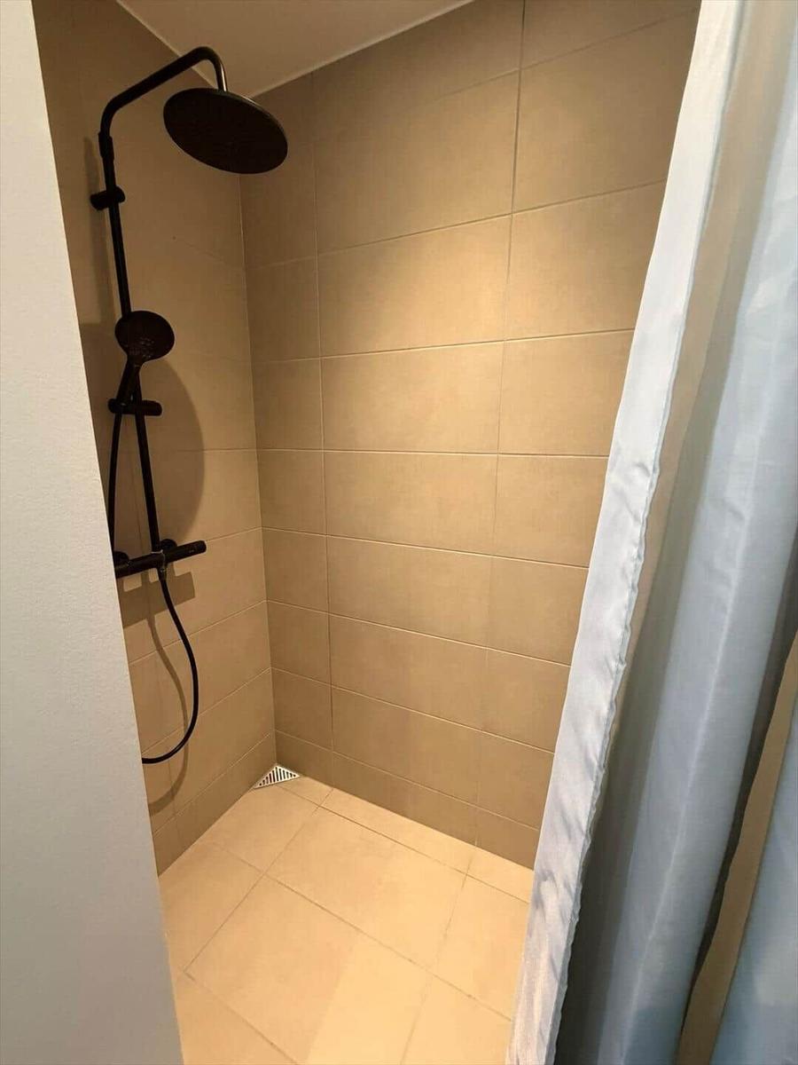 Shower with shower head and curtain