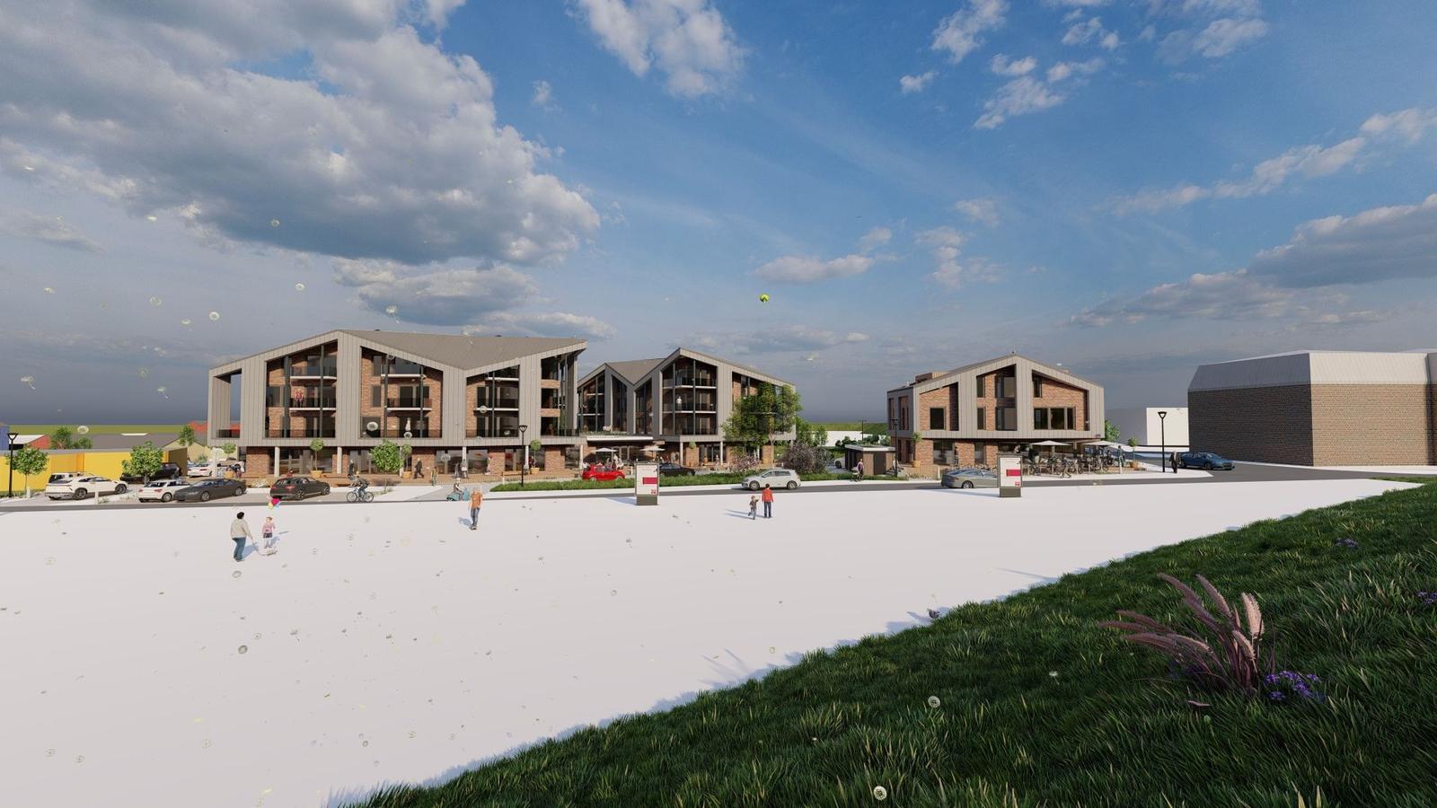 Moderne Wohnhäuser mit großzügigen Balkonen und gepflastertem Platz vorne.