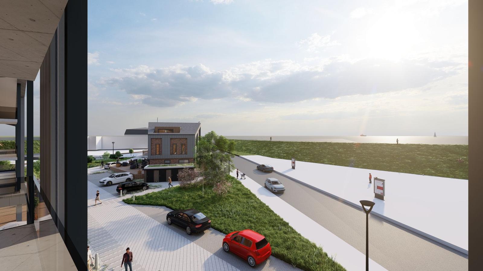 Modernes Haus mit Blick aufs Meer und gepflasterte Straße mit parkenden Autos.