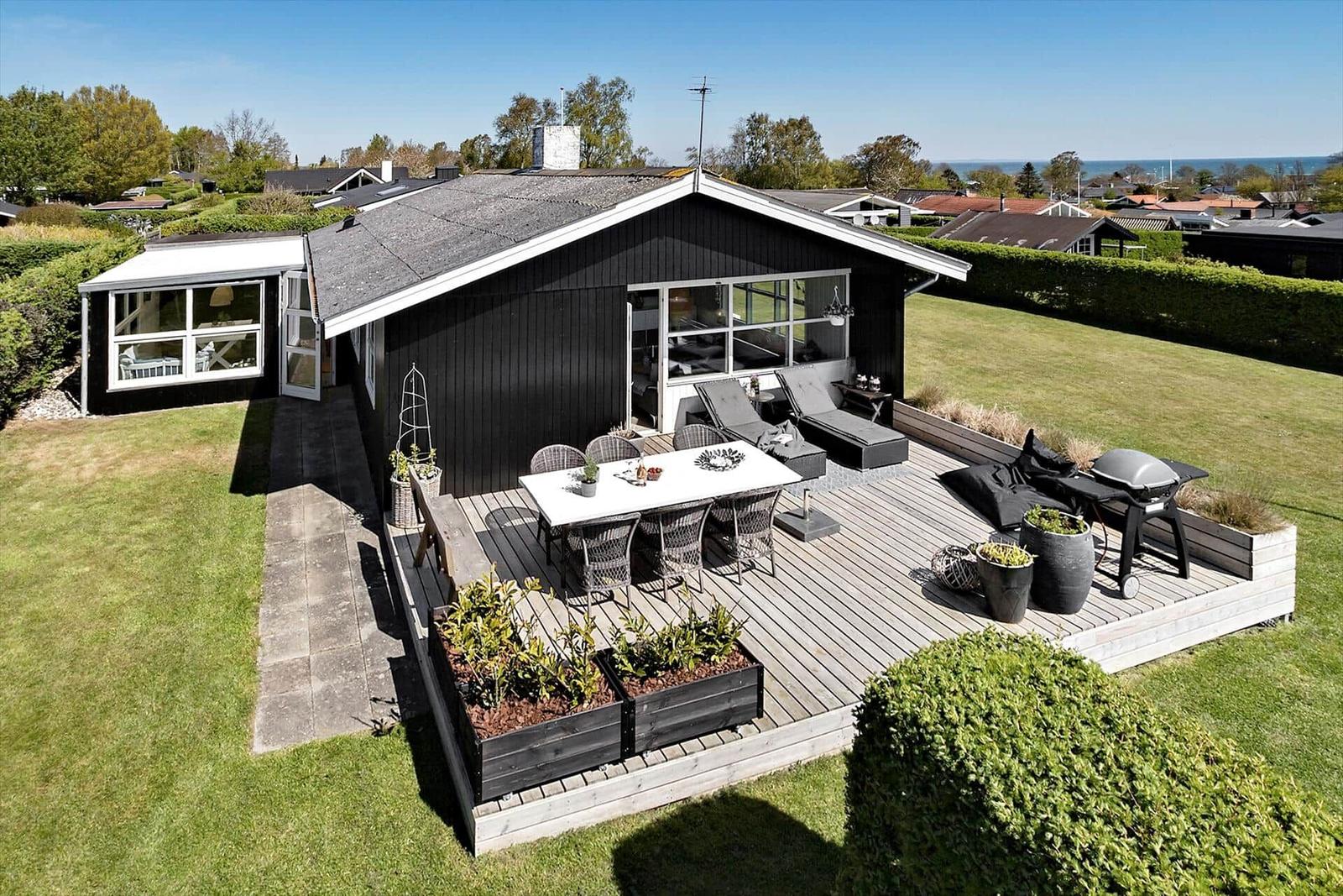 House with large deck, grill, and garden. View of the sea.