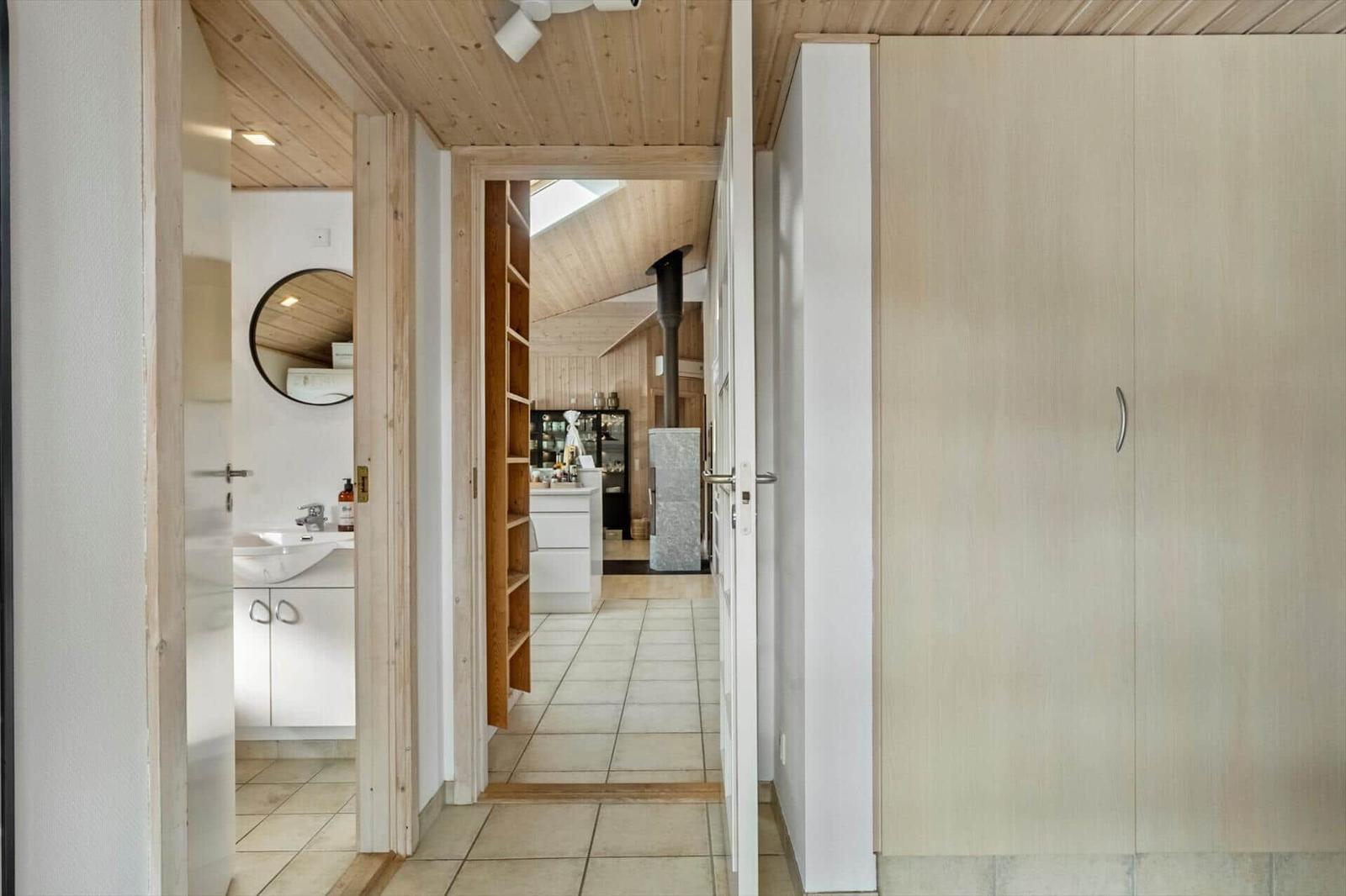 House with bathroom, kitchen, and wooden ceiling