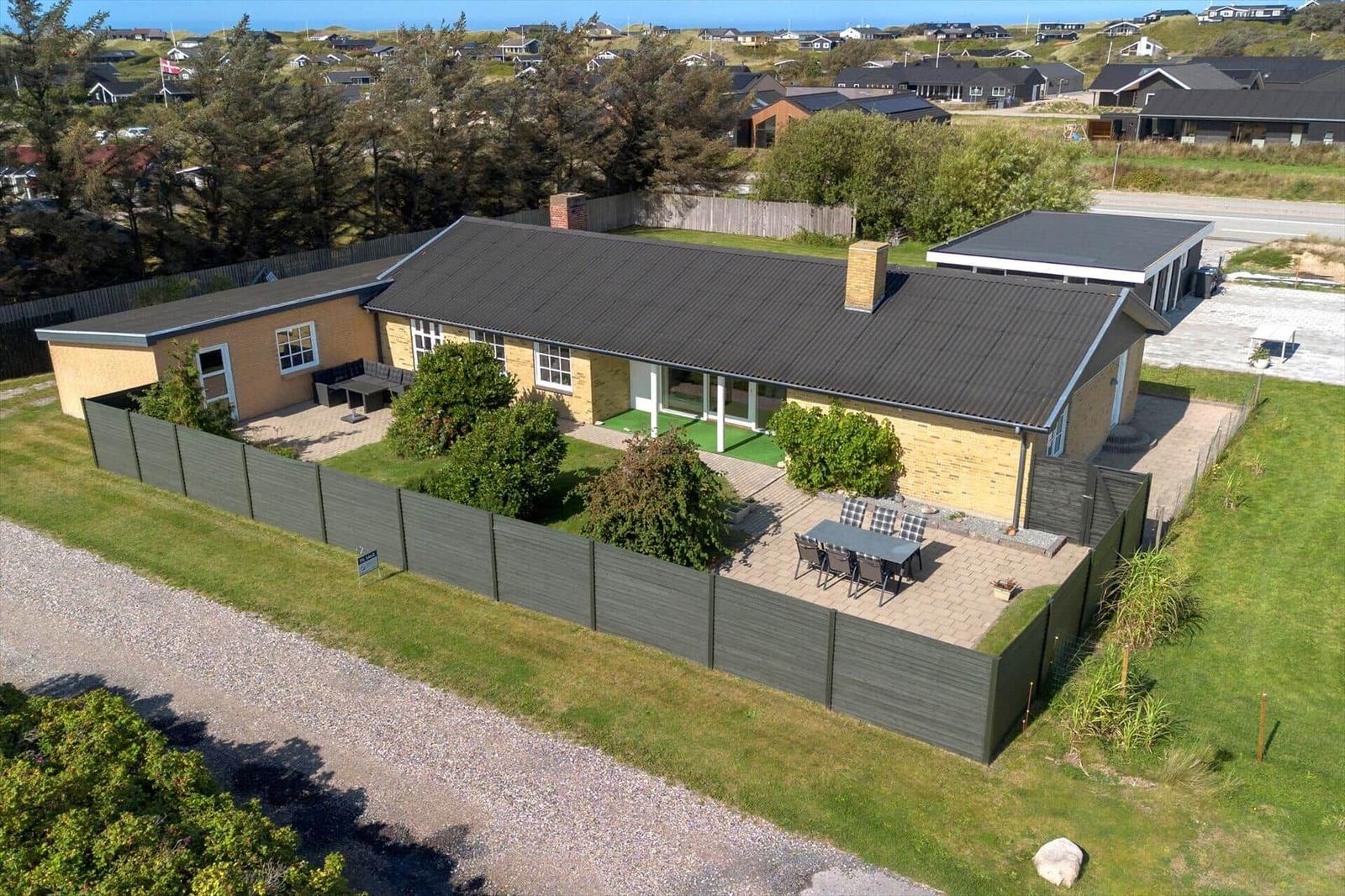 A modern house with terrace and garden. View of the surroundings.