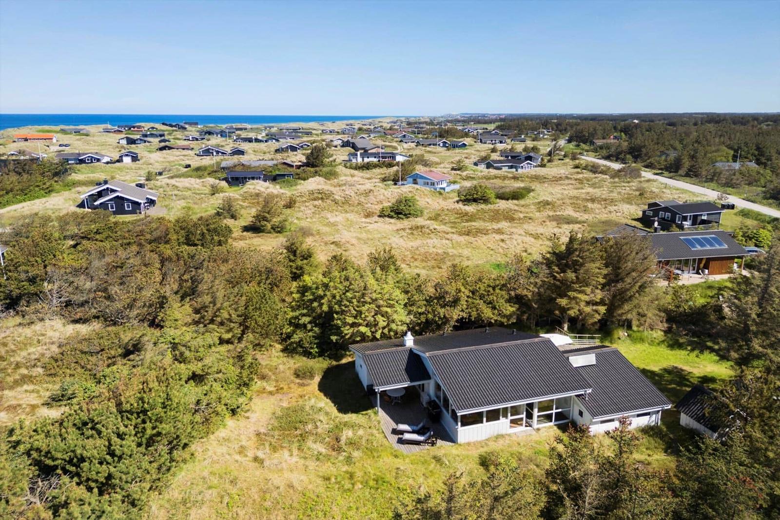 House with terrace in green surroundings, view of sea and villages