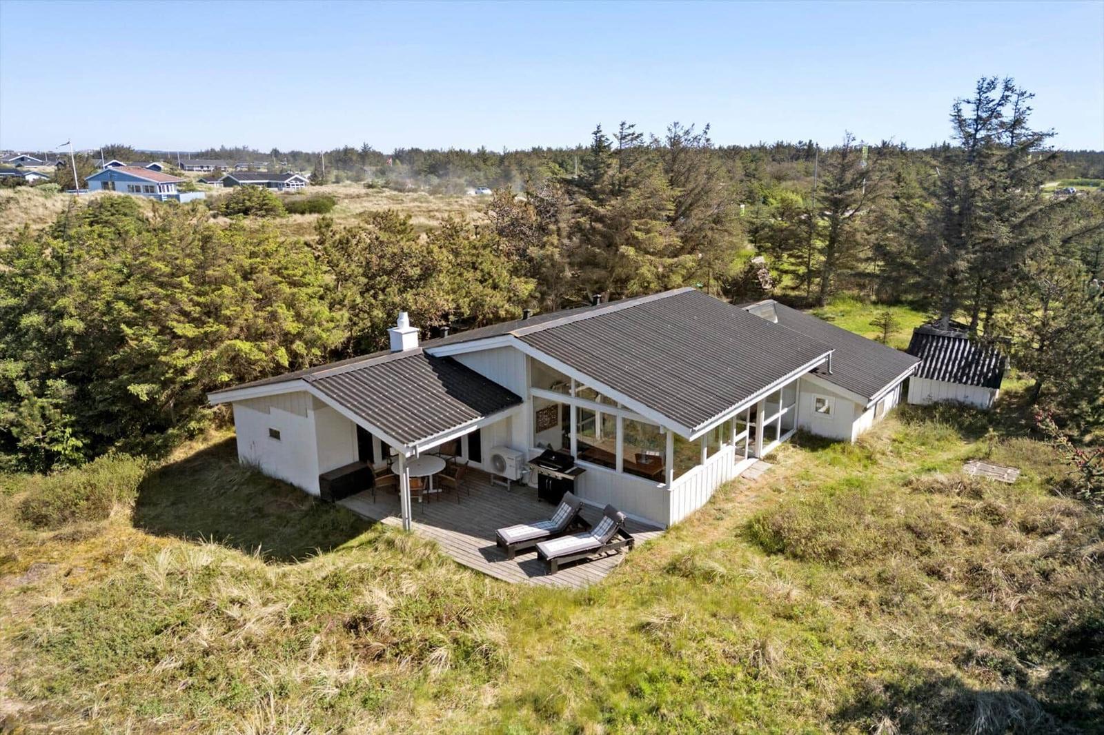House with terrace and grill area in green surroundings