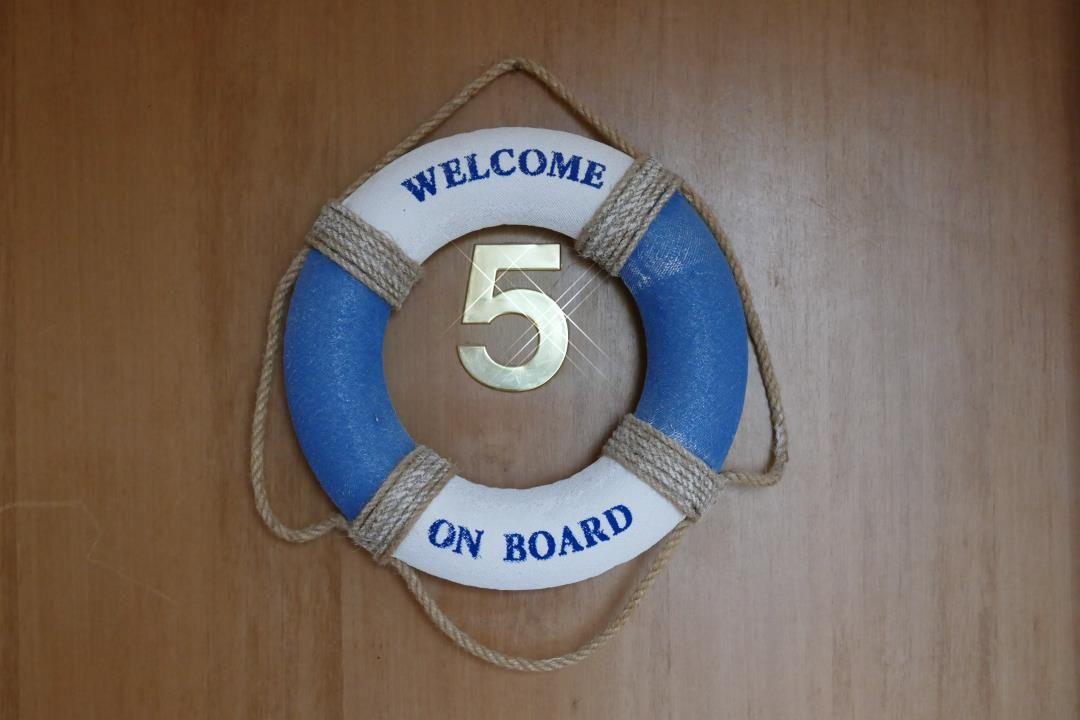 Welcome sign with number 5 on door