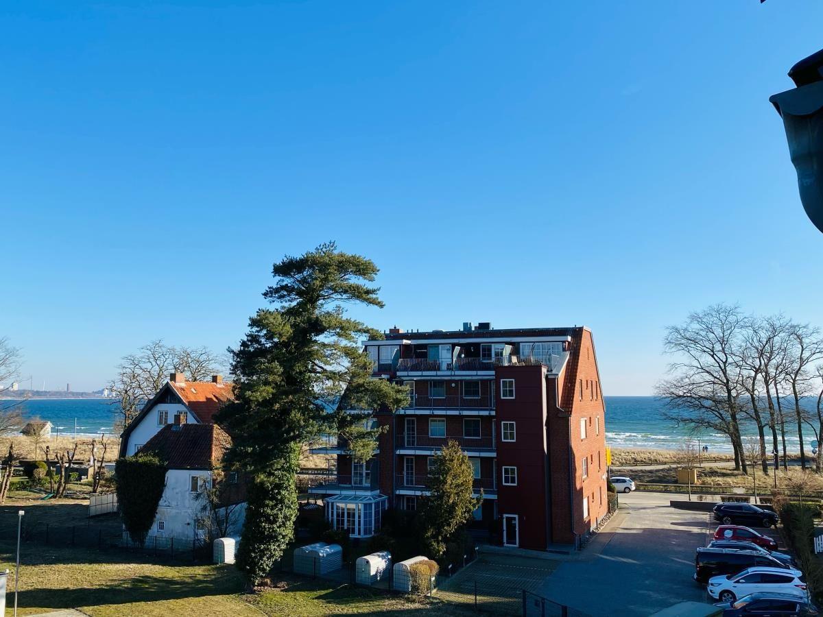 Red multi-family house with sea view and parking