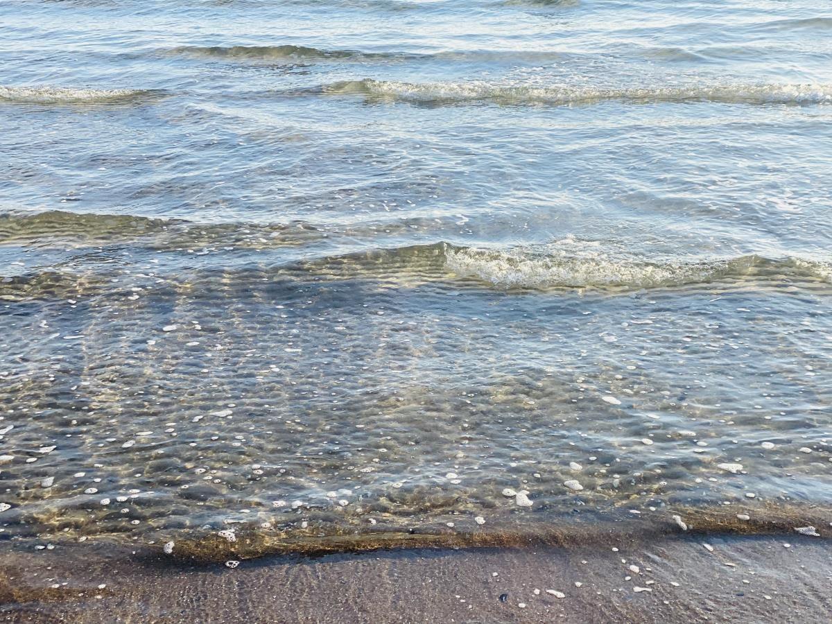 Clear water with waves at shoreline