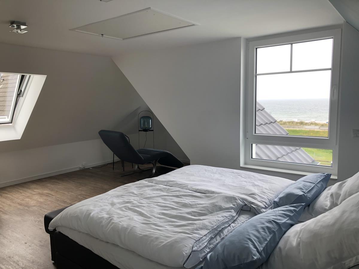 Bedroom with sea view and skylight