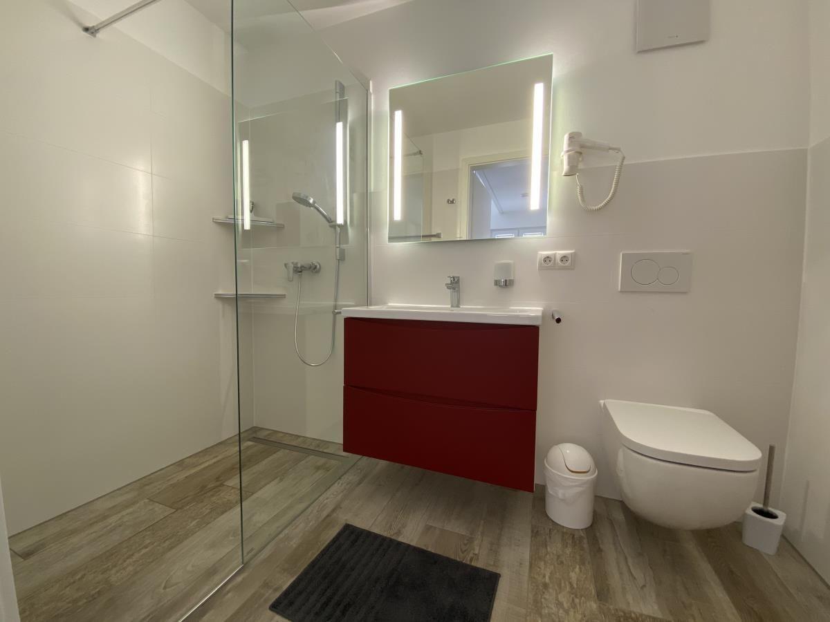 Bathroom with shower, sink and toilet