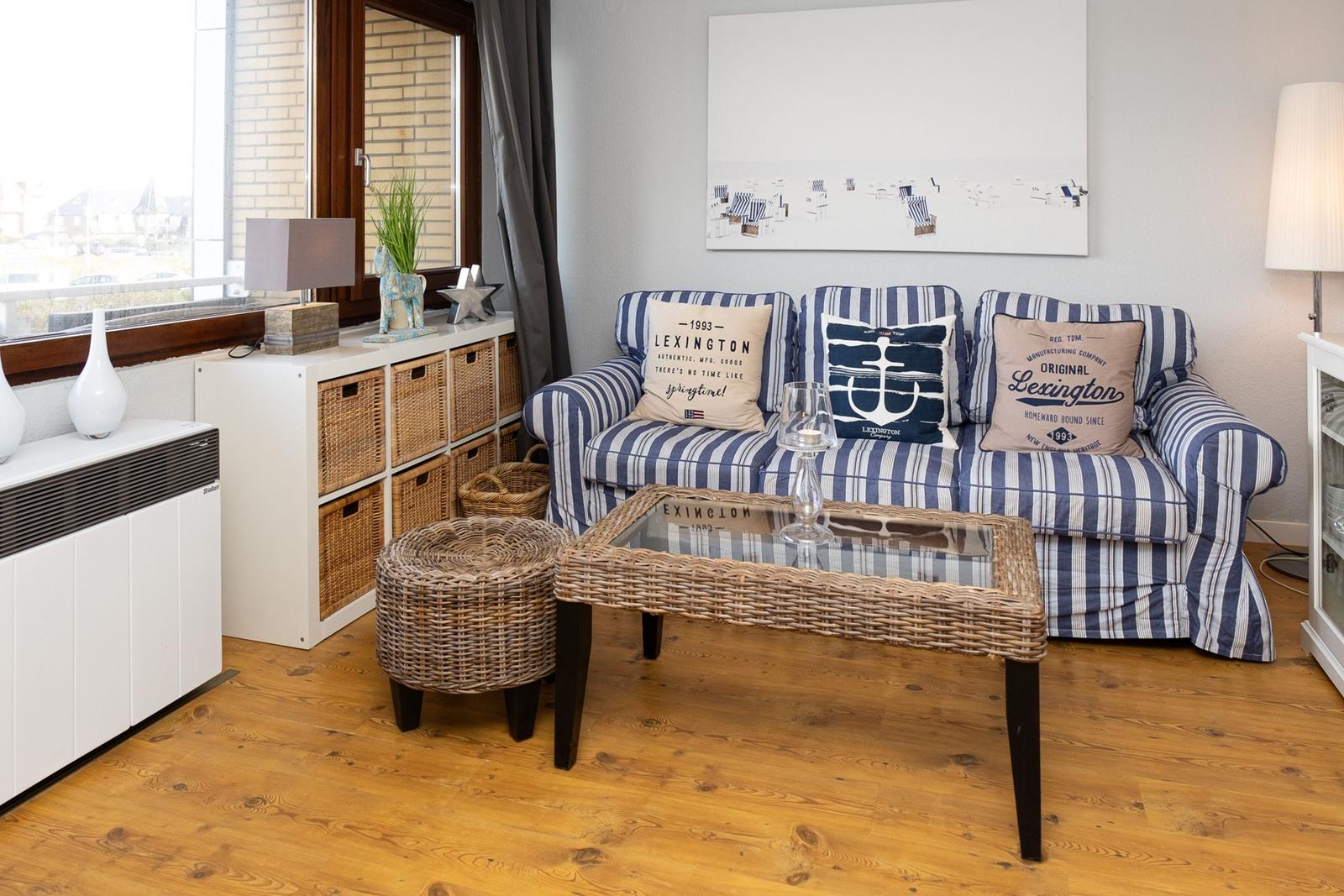 Living room with sofa, wicker storage and wooden floor
