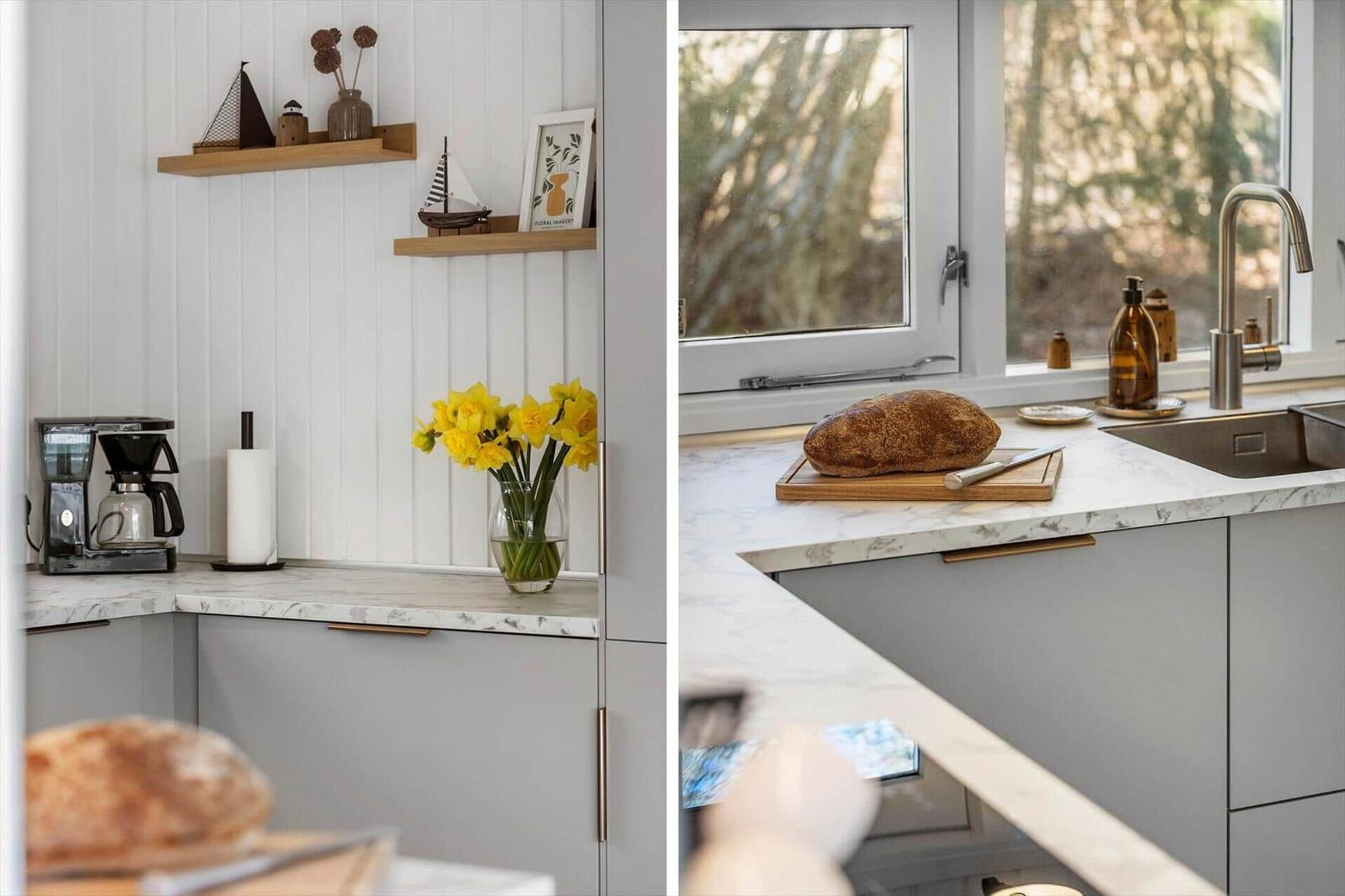 Kitchen with marble countertop, window, bread, and decor.