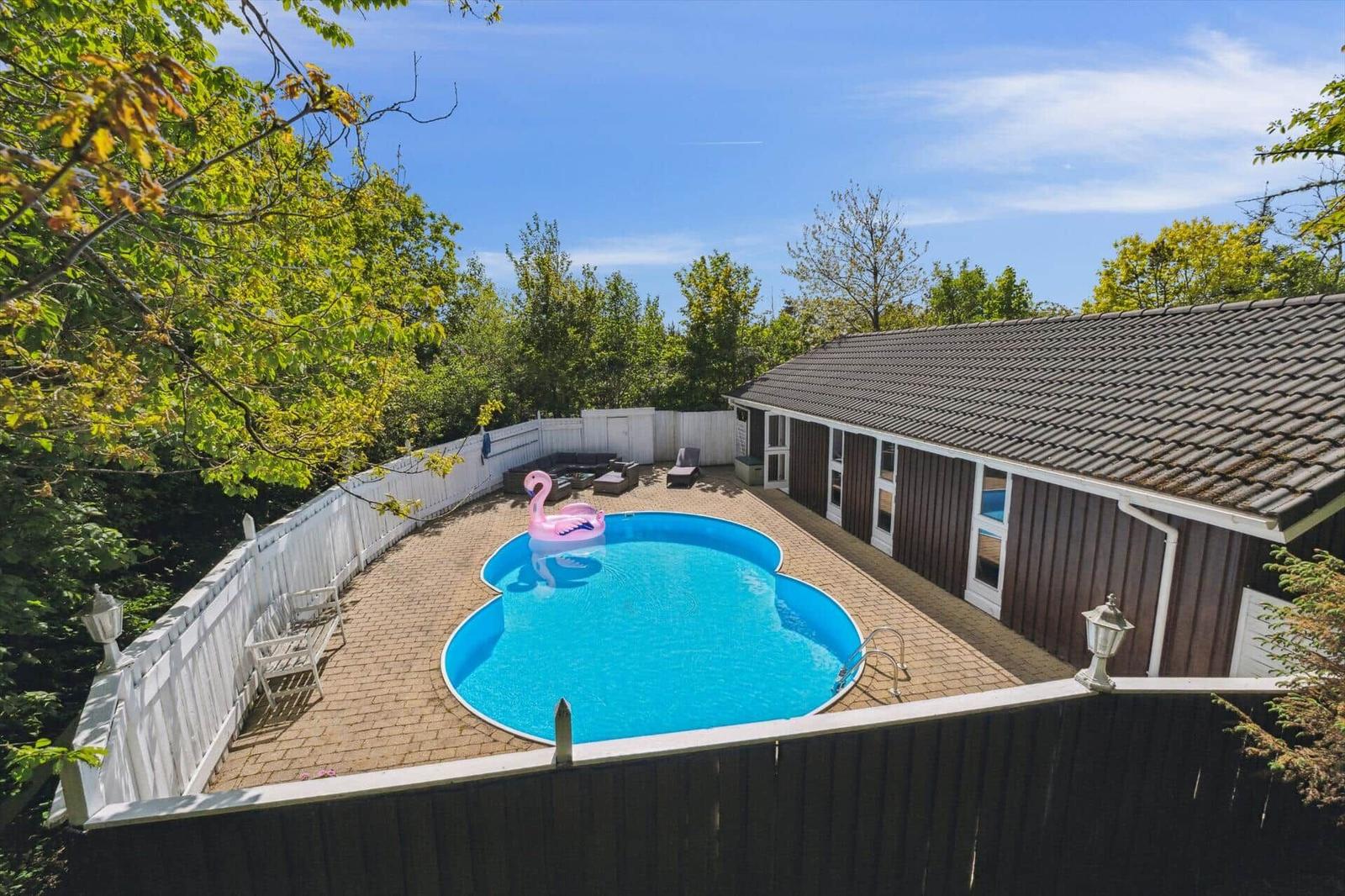 House with pool and terrace in greenery