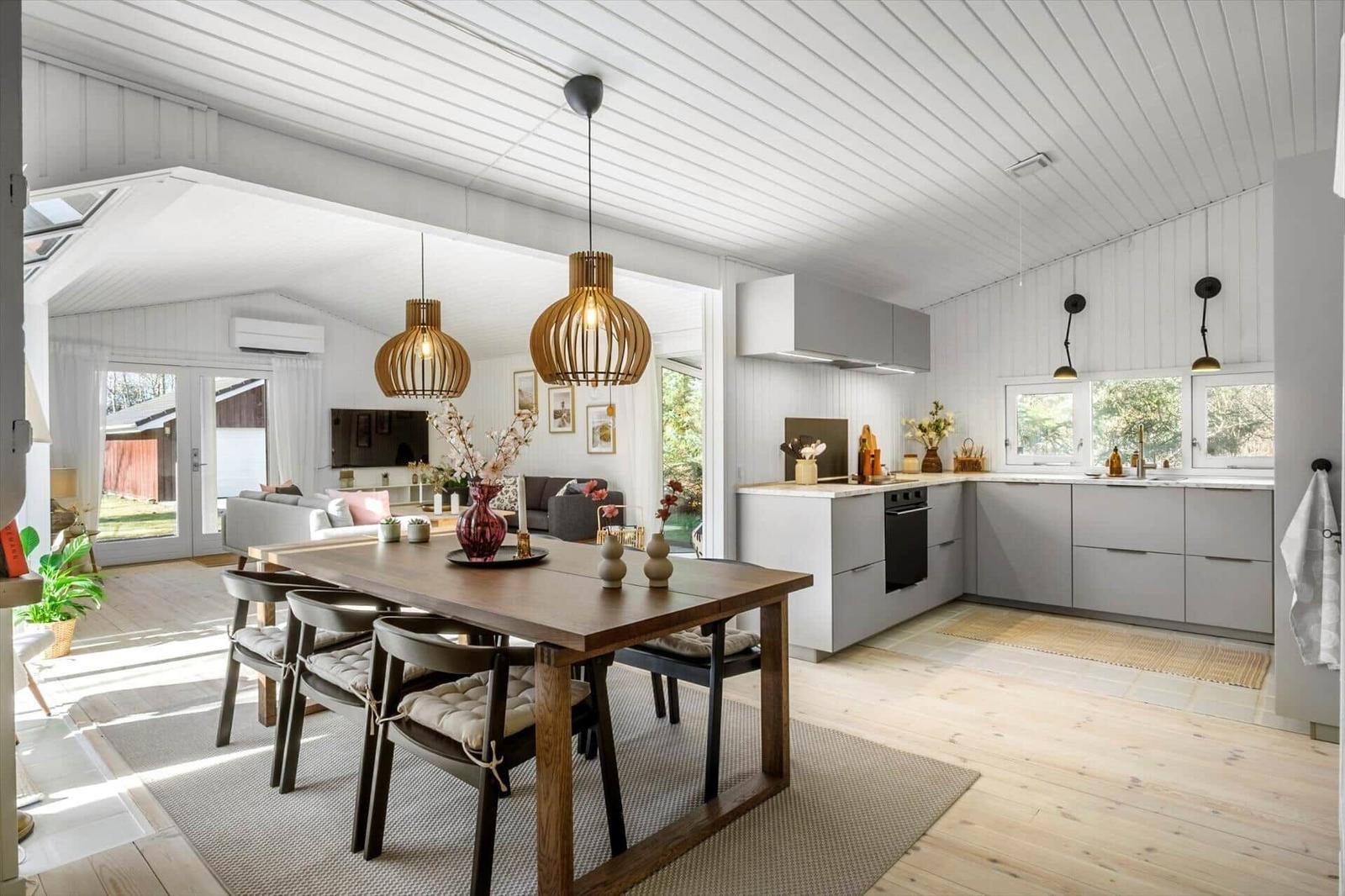 Kitchen with dining area and living room in the background.